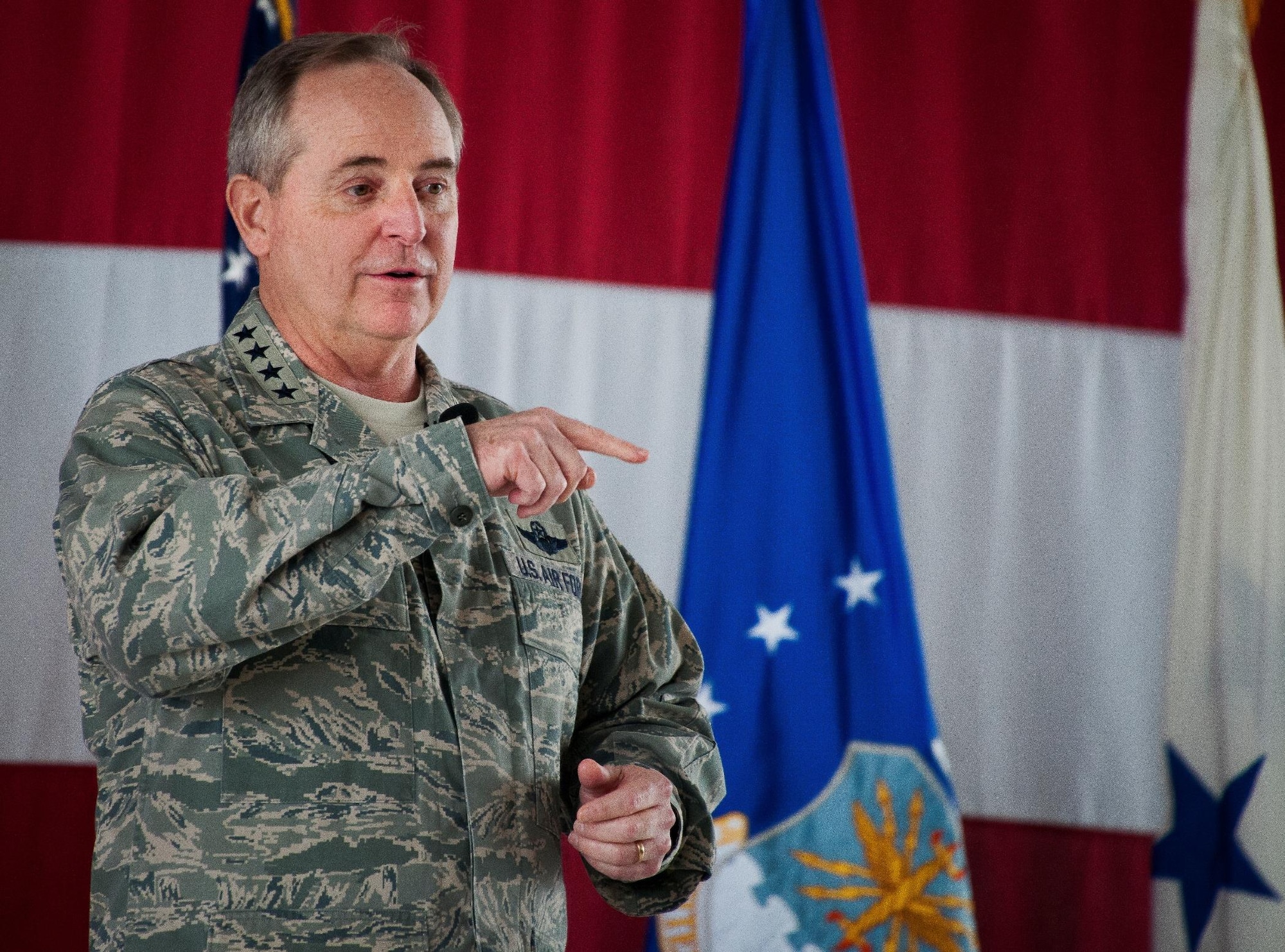 Air Force Chief of Staff Gen. Mark A. Welsh III speaks to an Airman in the audience during an all call Jan. 27, 2014, at Eglin Air Force Base, Fla. Welsh, along with his wife, Betty, spent two days meeting Airmen and their families, and learning about the missions of the various units at the base including the 53rd Wing, 96th Test Wing and 33rd Fighter Wing.  (U.S. Air Force photo/Samuel King Jr.)