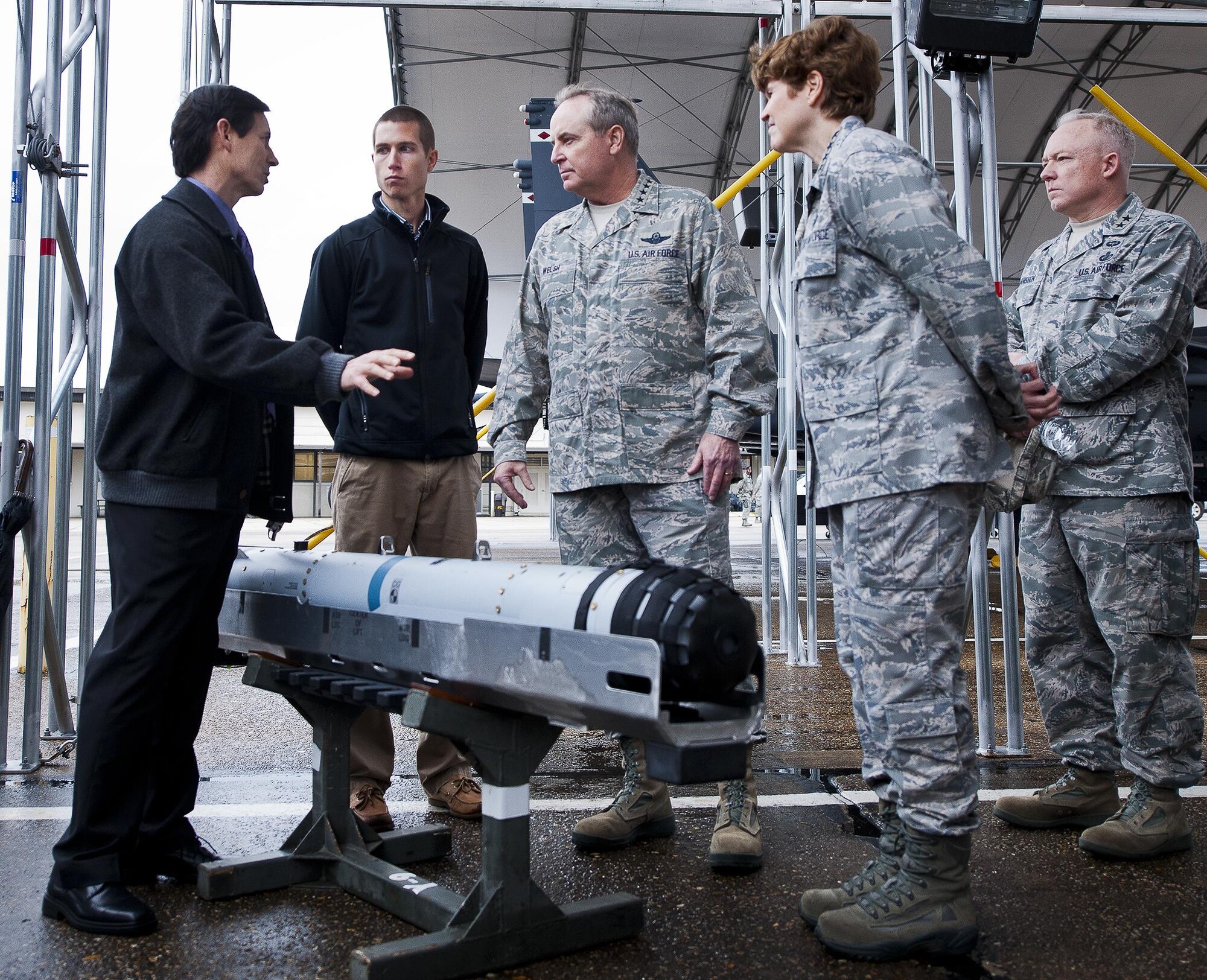 Dale Julio briefs Air Force Chief of Staff Gen. Mark A. Welsh III and Gen. Janet Wolfenbarger about the Small Diameter Bomb II test progress and findings Jan. 27, 2014, at Eglin Air Force Base, Fla. The generals received the brief as part of a developmental and operation test orientation to the 96th Test Wing and 53rd Wing. Wolfenbarger is the Air Force Materiel Command commander and Julio is from the 780th Test Squadron. (U.S. Air Force photo/Samuel King Jr.)