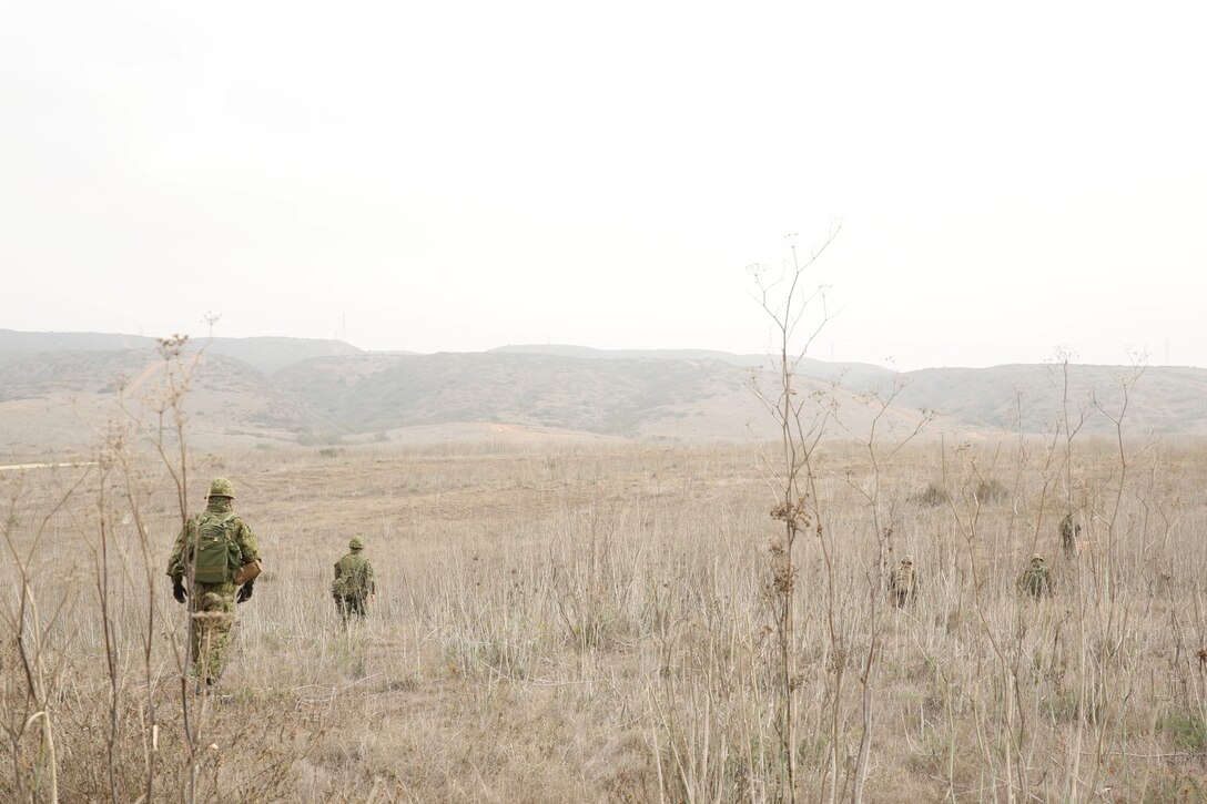 Soldiers from the Japan Ground Self-Defense Force conduct land navigation with 1st Air Naval Gunfire Liaison Company during Exercise Iron Fist 2014 aboard Camp Pendleton, Calif., Jan. 30, 2014. Iron Fist 2014 is an amphibious exercise that brings together Marines and sailors from the 15th Marine Expeditionary Unit, other I Marine Expeditionary Force units, and soldiers from the JGSDF, to promote military interoperability and hone individual and small-unit skills through challenging, complex and realistic training. (U.S. Marine Corps photo by Lance Cpl. Anna K. Albrecht/Released)
