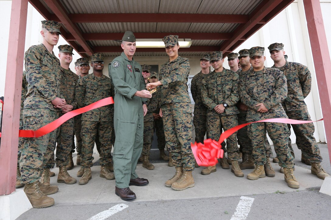 Col. John Farnam, commanding officer of Marine Corps Air Station Miramar, cuts a ribbon to open the Volunteer Income Tax Assistance Tax Center alongside Marines who work there during a ribbon cutting ceremony aboard MCAS Miramar, Calif., Jan. 30. The tax center has a team of Marines certified by the Internal Revenue Service to file taxes free of charge for active-duty service members, retirees and military spouses. For more information call 858-577-1040.