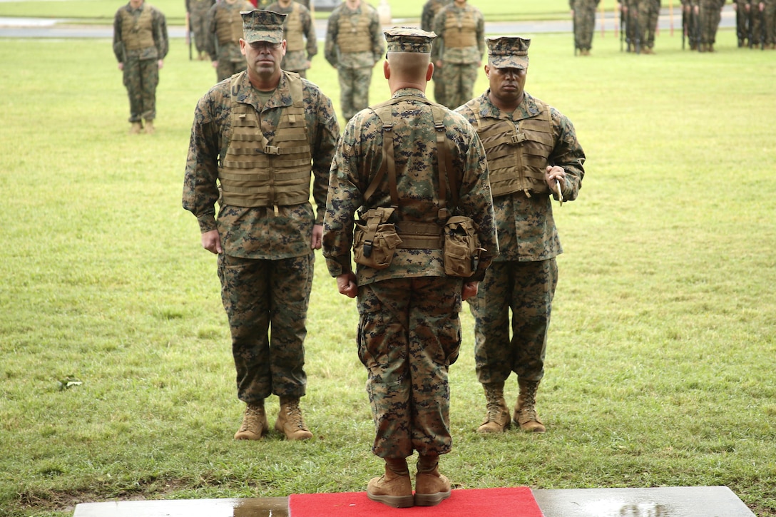 Sgt. Maj. Steven E. Collier prepares to relinquish the noncommissioned officer’s sword to Lt. Col. Robert K. Maldonado during a Post and Relief Ceremony at Dewey Square, Jan. 28, 2014. (U.S. Marine Corps photo by Lance Cpl. Janelle Y. Villa)
