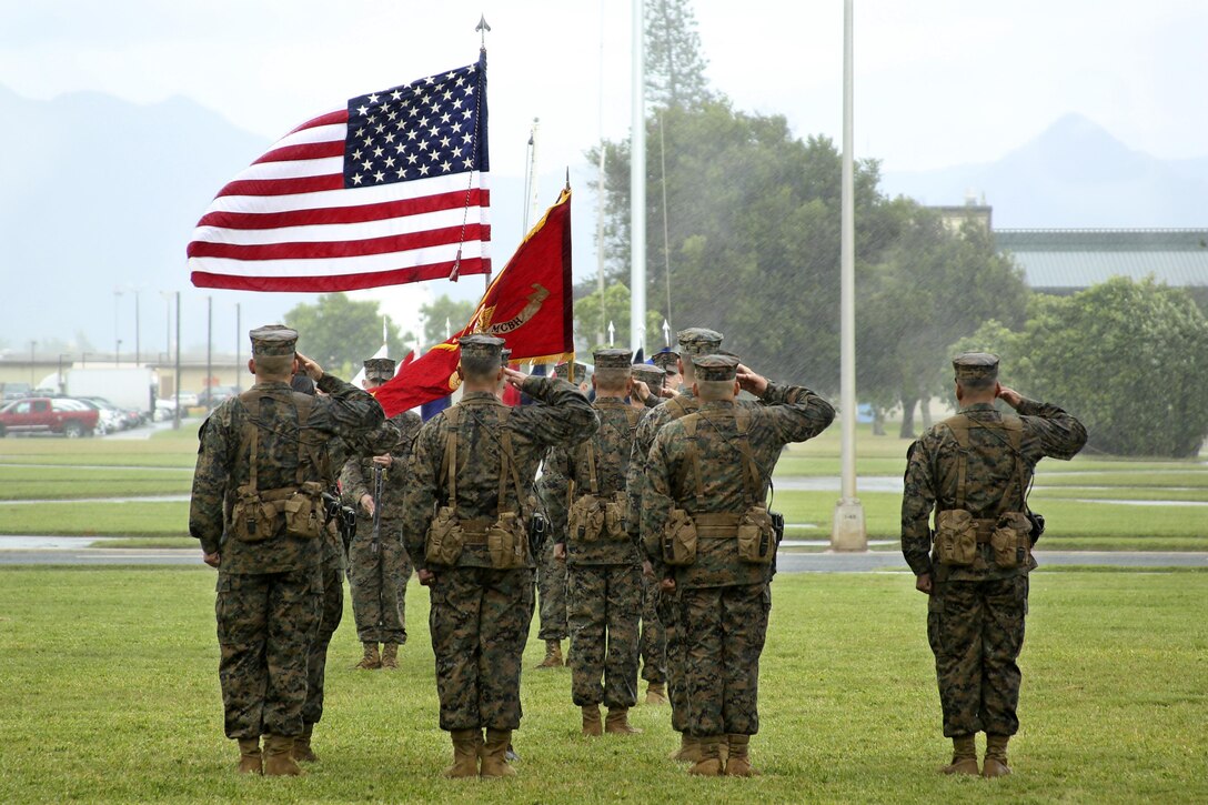 Collier passes Headquarters Bn. torch to Rose in Post and Relief Ceremony