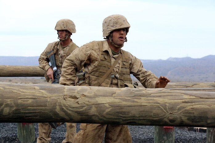 Pvt. Ali J. Mohammed, Platoon 2134, Company F, 2nd Recruit Training Battalion, jumps over a log set during the Obstacle Course during the Crucible at Edson Range, Jan 21. Mohammed enlisted in the Marine Corps to help and protect the freedoms he enjoys in the U.S.