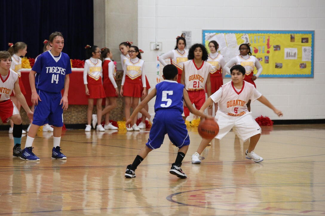 Quantico Middle School basketball players block the opposing team from passing the ball at the Quantico Middle School Warriors versus Dahlgren Middle School Tigers game on Jan. 14, 2014. The Warriors were victorious, 54-22.