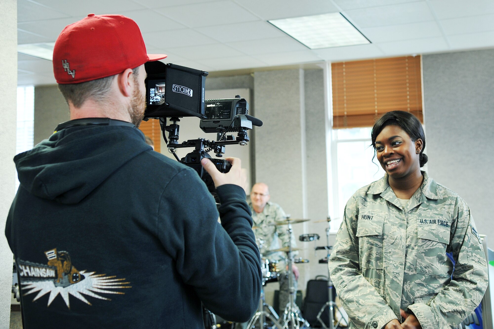 James Wright, a segment producer for American Idol, interviews Senior Airman Paula Hunt, a vocalist with the Heartland of America Band at Offutt Air Force Base, Neb., for the Omaha auditions episode of the show. Hunt appeared on the Jan. 30 episode of American Idol and received three yeses from the judges, ensuring her a ticket to Hollywood Week. (Photo by Charles Haymond) 