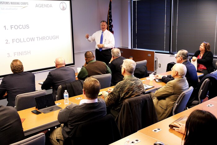 Michael Halloran, director of science and technology at Program Executive Officer Land Systems, addresses business representatives Jan. 30 at the Industry Interface Council in Dumfries, Va. Led by Marine Corps Systems Command, the council meets quarterly to enhance the command's effectiveness and glean ideas and feedback from industry leaders about improving communications.