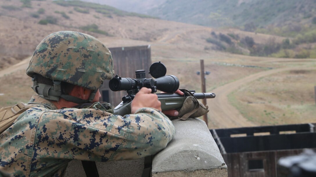A sniper with 2nd Battalion, 1st Marines, locks in on his targer during the sniper marathon course here Jan. 30. The course consisted of engaging an unknown number of targets from elevated positions with various weapon systems.