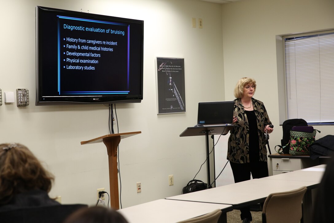 Dr. Barbara Craig, MD, director of the Armed Forces Center for Child Protection at Walter Reed National Military Medical Center, leads Child Abuse and Neglect Prevention and Response Training  at the U.S. Marine Corps Memorial Chapel Annex on Jan. 16, 2014. Craig focused on bruises, bites, burns and fractures during this training.