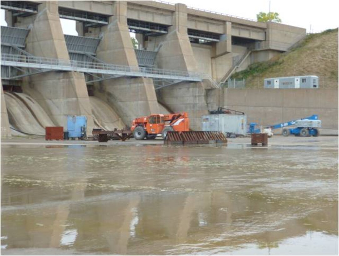 A contractor makes repairs to the emergency spillway slab at Garrison Dam, Riverdale, N.D. This project is part of the Disaster Relief Appropriations Act, 2012 (DRAA) funded efforts to repairs dams to the dams as a result of the 2011 Flood