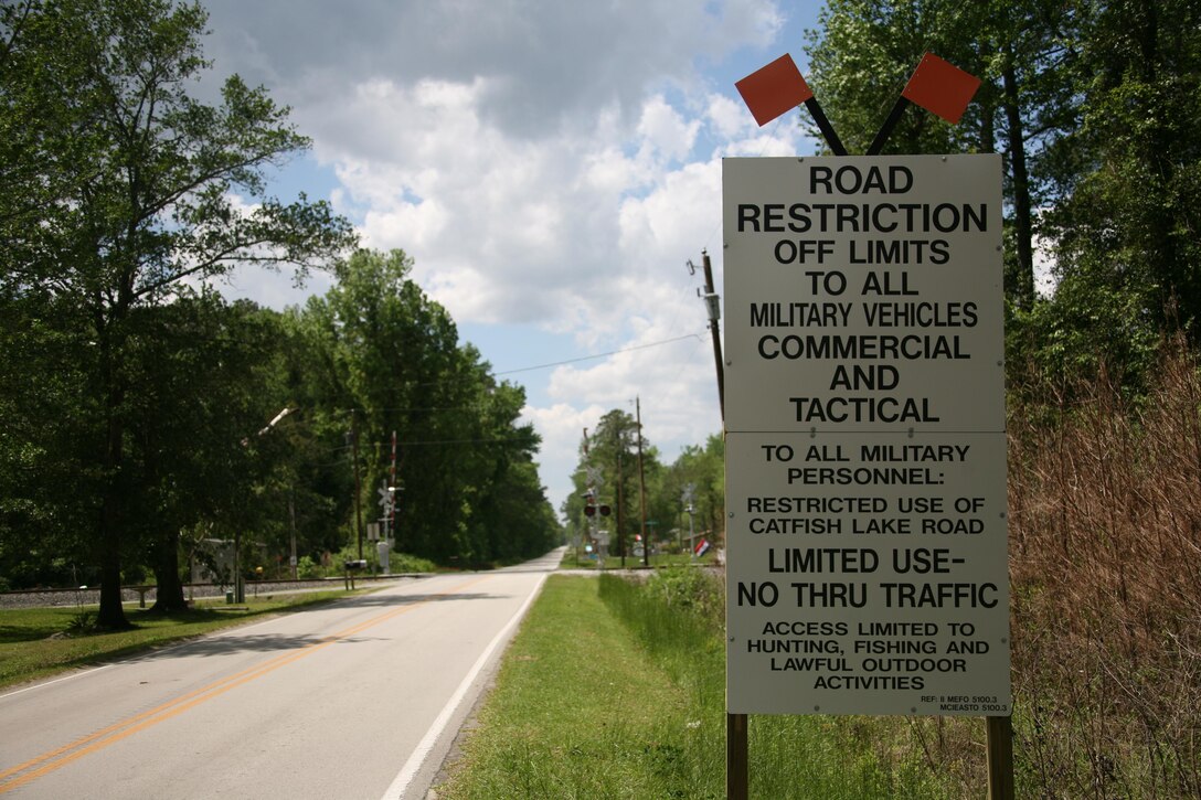 A sign outside of Catfish Lake Road warns servicemembers of its restricted access to all military vehicles commercial and tactical. For local Marines and Sailors, use of Catfish Lake Road in Craven and Jones Counties is strictly prohibited for commuting across the Croatan National Forest in accordance with II Marine Expeditionary Force and Marine Corps Installations East Order 5100.3.


