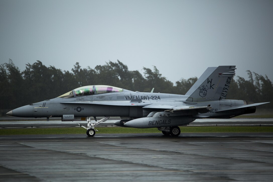An F/A-18D Hornet with Marine All-Weather Fighter Attack Squadron 224 prepares to enter the runway on the flight line at Marine Corps Air Station Kaneohe Bay, Jan. 29, 2014. The unit is stationed at MCAS Beaufort, and is currently on a six-month deployment through the Western Pacific. VMFA(AW)-224 arrived in Hawaii, Jan 10., to participate in Exercise Lava Viper at Pohakuloa Training Area. (U.S. Marine Corps photo by Lance Cpl. Matthew Bragg)