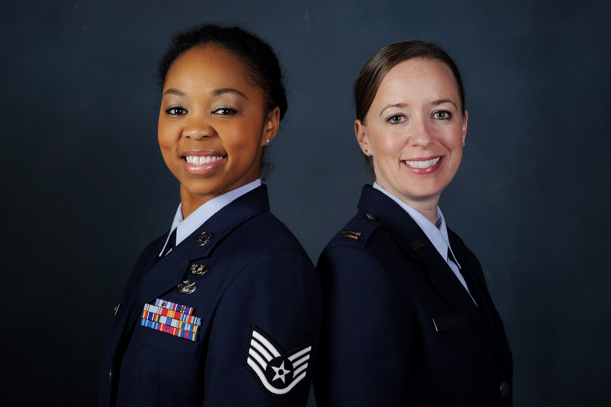 Staff Sgt. Keisha Bogard, Area Defense Council defense paralegal, left, and Capt. Rachel Lyons, ADC representative, provide non-biased legal advice and defense for Airmen facing various forms of disciplinary and corrective actions. The Buckley ADC serves Team Buckley, as well as active-duty Air Force members along the Front Range and beyond. (U.S. Air Force photo by Senior Airman Phillip Houk/Released)