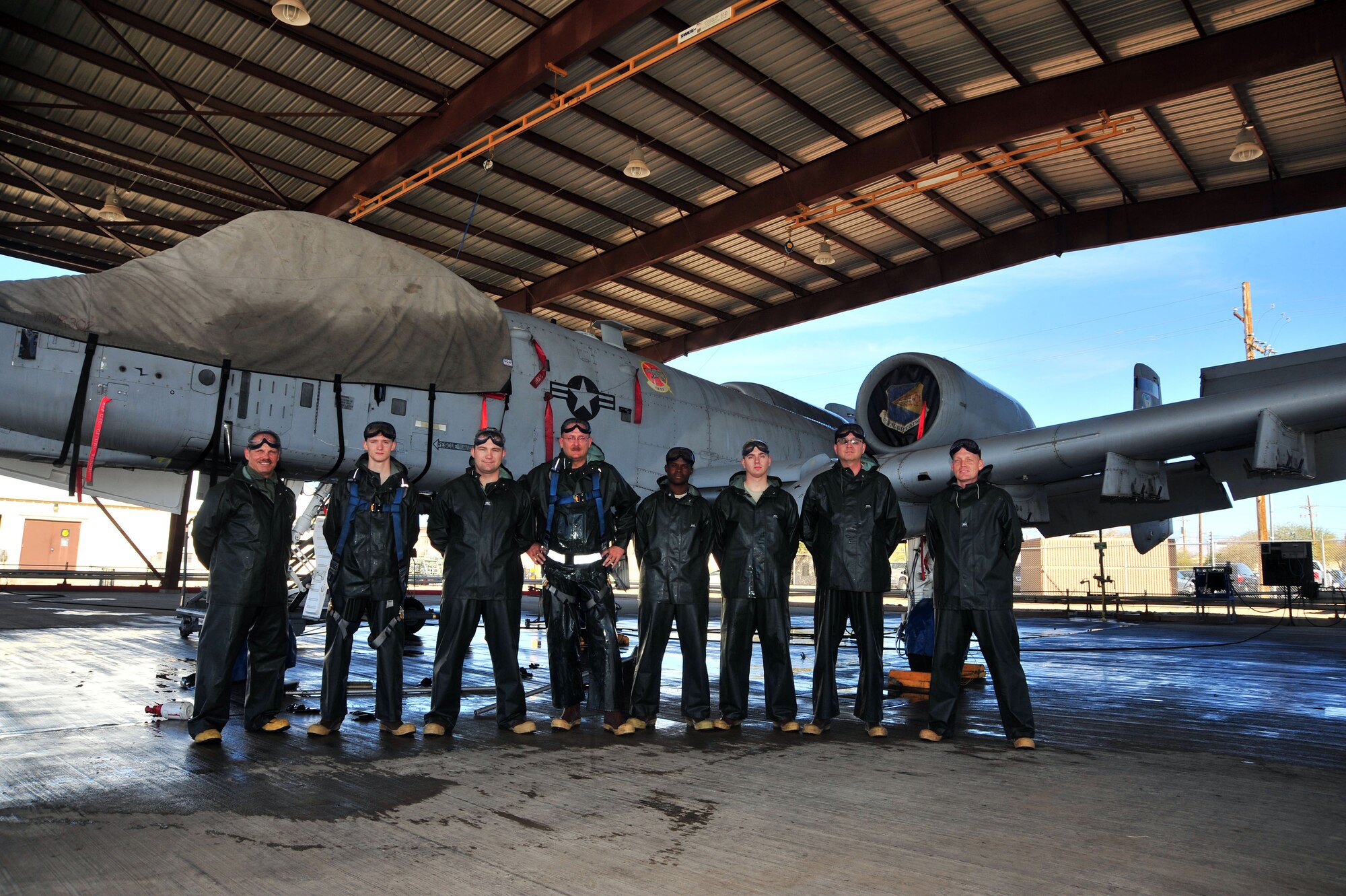 U.S. Air Force Airmen from the 355th Aircraft Maintenance Squadron pose for a photo with their leadership in front of an A-10C Thunderbolt at Davis-Monthan Air Force Base, Ariz., Jan. 28, 2014. The 355th AMXS  Leadership helped wash the aircraft after the squadron went 60 days without any safety or technical violations.(U.S. Air Force photo by Senior Airman Josh Slavin/released)