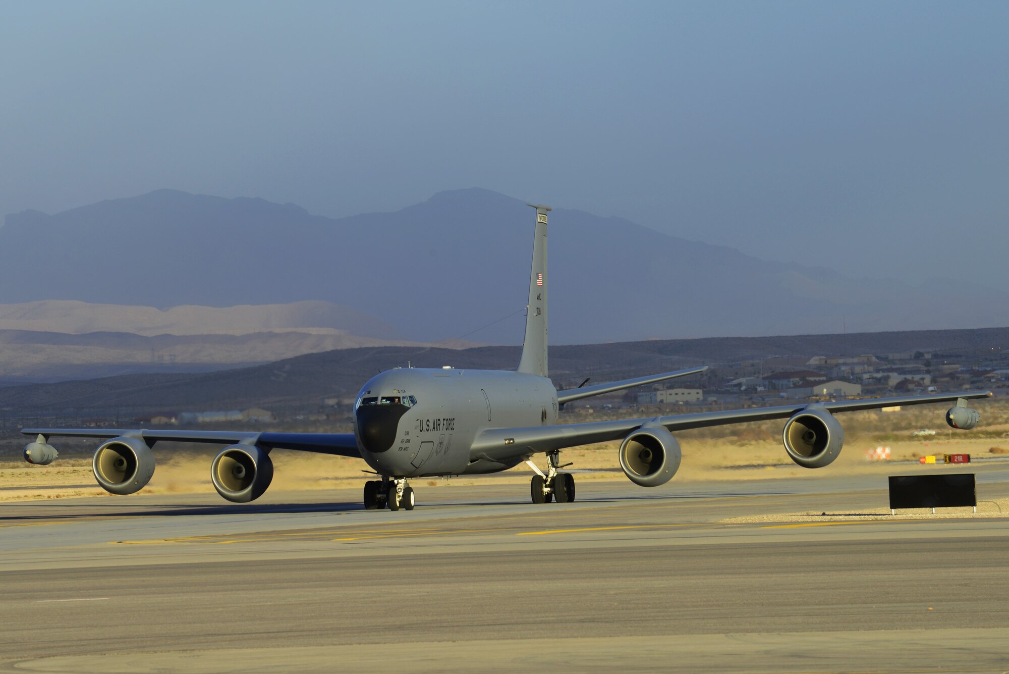 A KC-135 Stratotanker from McConnell Air Force Base, Kan., taxis toward the parking lanes after a flight in support of the combat exercise Red Flag 14-1 Jan. 30, 2014. Two aircraft along with more than 30 personnel from the 22nd Air Refueling Wing are currently on temporary duty assignment at Nellis AFB, Nev., participating in the multinational combat exercise Red Flag 14-1. Red Flag gives aircrews and air support operations service members from various airframes, military services and allied countries an opportunity to integrate and practice combat operations. (U.S. Air Force photo by Senior Airman Benjamin Sutton/Released) 