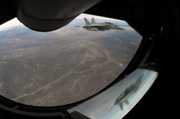An EA-18G Growler from Naval Air Station Whidbey Island, Wash., is refueled by a KC-135 Stratotanker from Fairchild Air Force Base, Wash., during Red Flag 14-1 Jan. 29, 2014, over the Nevada Test and training Range. Red Flag has expanded to incorporate all spectrums of warfare to include command and control, real-time intelligence, analysis and exploitation, and electronic warfare. (U.S. Air Force photo/Staff Sgt. Veronica Montes)
