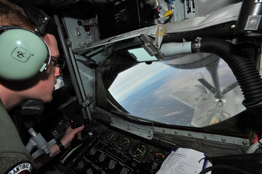 Airman 1st Class Ryan Kemp, 92nd Air Refueling Squadron boom operator, refuels an F-22 Raptor from Joint Base Langley-Eustis, Va., while aboard a KC-135 Stratotanker during Red Flag 14-1 Jan. 29, 2014, over the Nevada Test and Training Range. More than 440,000 service members have participated in Red Flag since 1975, including more than 145,000 aircrew members flying more than 385,000 thousand sorties and logging more than 660,000 flight hours. (U.S. Air Force photo/Staff Sgt. Veronica Montes)