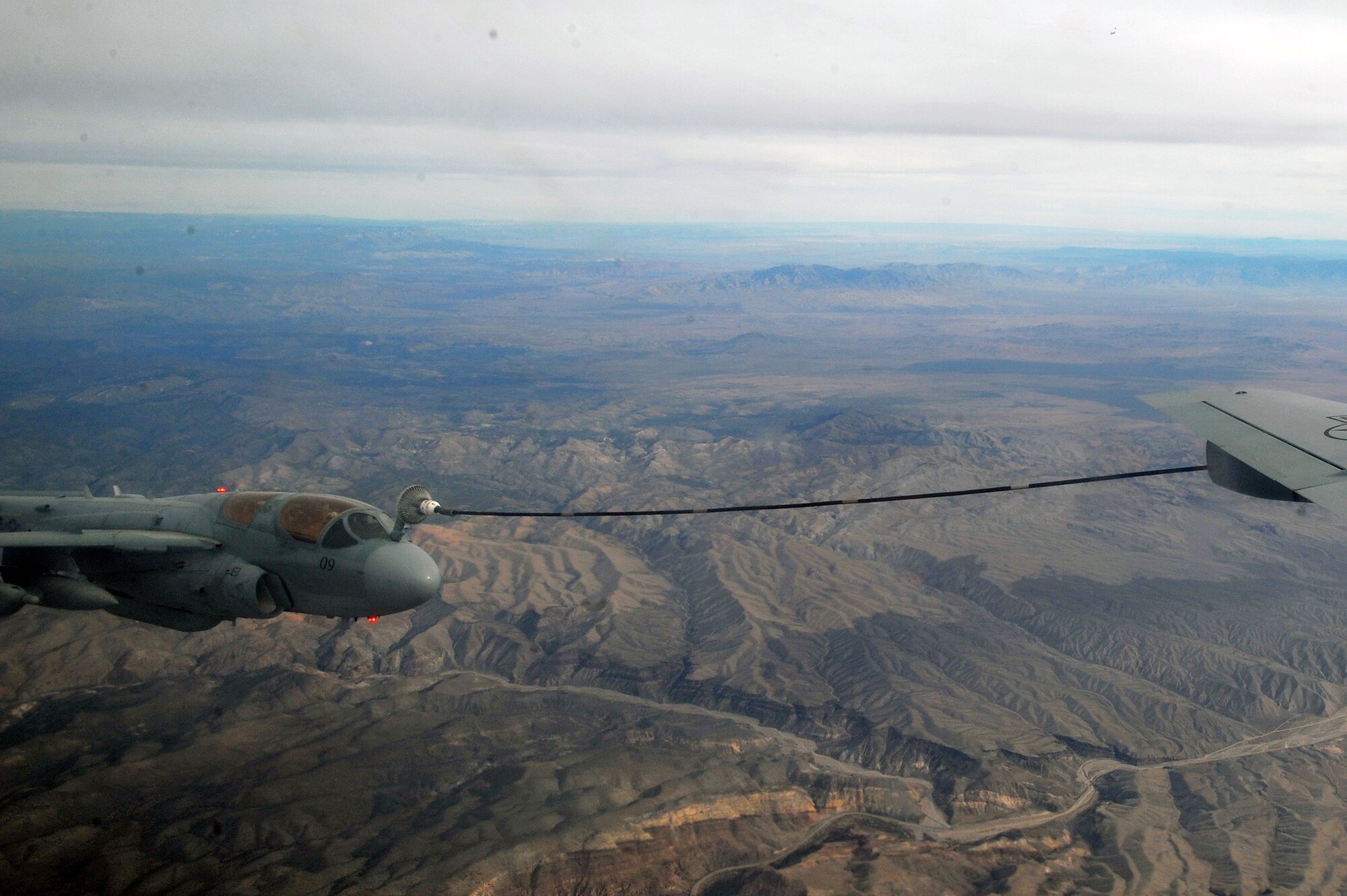 An EA-6B Prowler from Marine Corps Air Station Cherry Point, N.C., is refueled by a KC-135 Stratotanker from Fairchild Air Force Base, Wash., during Red Flag 14-1 Jan. 29, 2014, over the Nevada Test and Training Range. Red Flag is a realistic combat training exercise that incorporates air, space and cyber forces as part of the blue forces and their adversaries, the red forces. (U.S. Air Force photo by Staff Sgt. Veronica Montes/Released)

