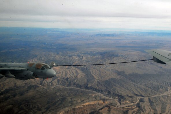An EA-6B Prowler from Marine Corps Air Station Cherry Point, N.C., is refueled by a KC-135 Stratotanker from Fairchild Air Force Base, Wash., during Red Flag 14-1 Jan. 29, 2014, over the Nevada Test and Training Range. Red Flag is a realistic combat training exercise that incorporates air, space and cyber forces as part of the blue forces and their adversaries, the red forces. (U.S. Air Force photo/Staff Sgt. Veronica Montes)