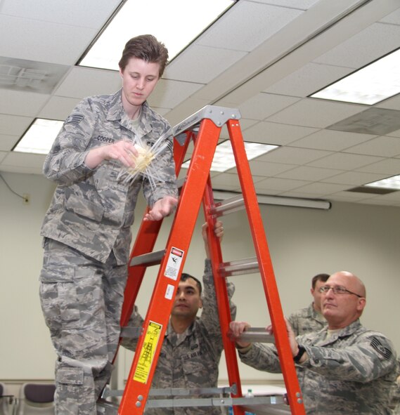 Members of the 932nd Airlift Wing began a two-week Non-Comissioned Officers Leadership Course (NCOLC) this week at Scott Air Force Base. Members attending the class were put into groups, given specific materials and were told to construct an apparatus that could transport an egg safely, and then test the device by dropping it from various heights.  The purpose of the exercise was to show the class how to affectively work in teams.  Members attending the class were instructed Senior Master Sgt. Martin Walker, the Program Manager for Air Force Reserve Command, facilitated the course and stated, "It's important because we need to have prepared leaders to take on the next mission and this class provides that leadership training." (U.S. Air Force photo/Staff Sgt. Meiko Schill)
