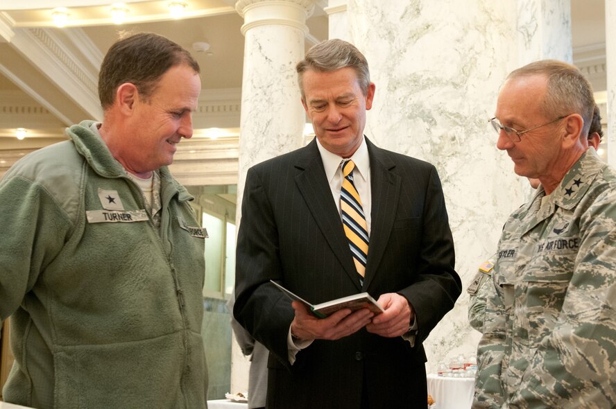 Idaho State Lt. Gov. Brad Little, middle, talks with Idaho National Guard Commanding General Maj. Gen. Gary Sayler, right, and Brig. Gen. Richard Turner, left, Assistant Adjutant General, Air, about construction for future facilities and the economic impact contributing to the economy during the Military Division Legislative Day held at the State Capitol building in Boise, Idaho Jan. 15. (Air National Guard photo by Master Sgt. Becky Vanshur)