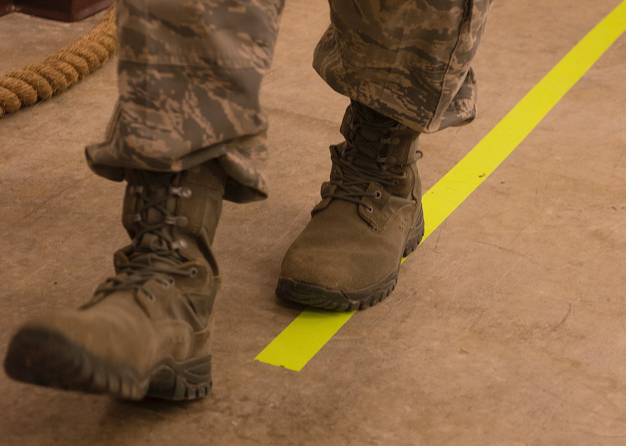 An Airman from the 823d Base Defense Squadron walks the line during an Alcohol Drug Abuse Prevention and Treatment demonstration at Moody Air Force Base, Ga., Jan. 31, 2014. Airmen of the 823d Base Defense Squadron took turns wearing the vision-impairing goggles while walking the line, maneuvering a course in a pedal cart, catching a ball and participating in other activities. The visibility through the goggles was equivalent to someone’s vision with a blood alcohol content level ranging from .04 to .25. (U.S. Air Force photo by Senior Airman Tiffany M. Grigg/Released)