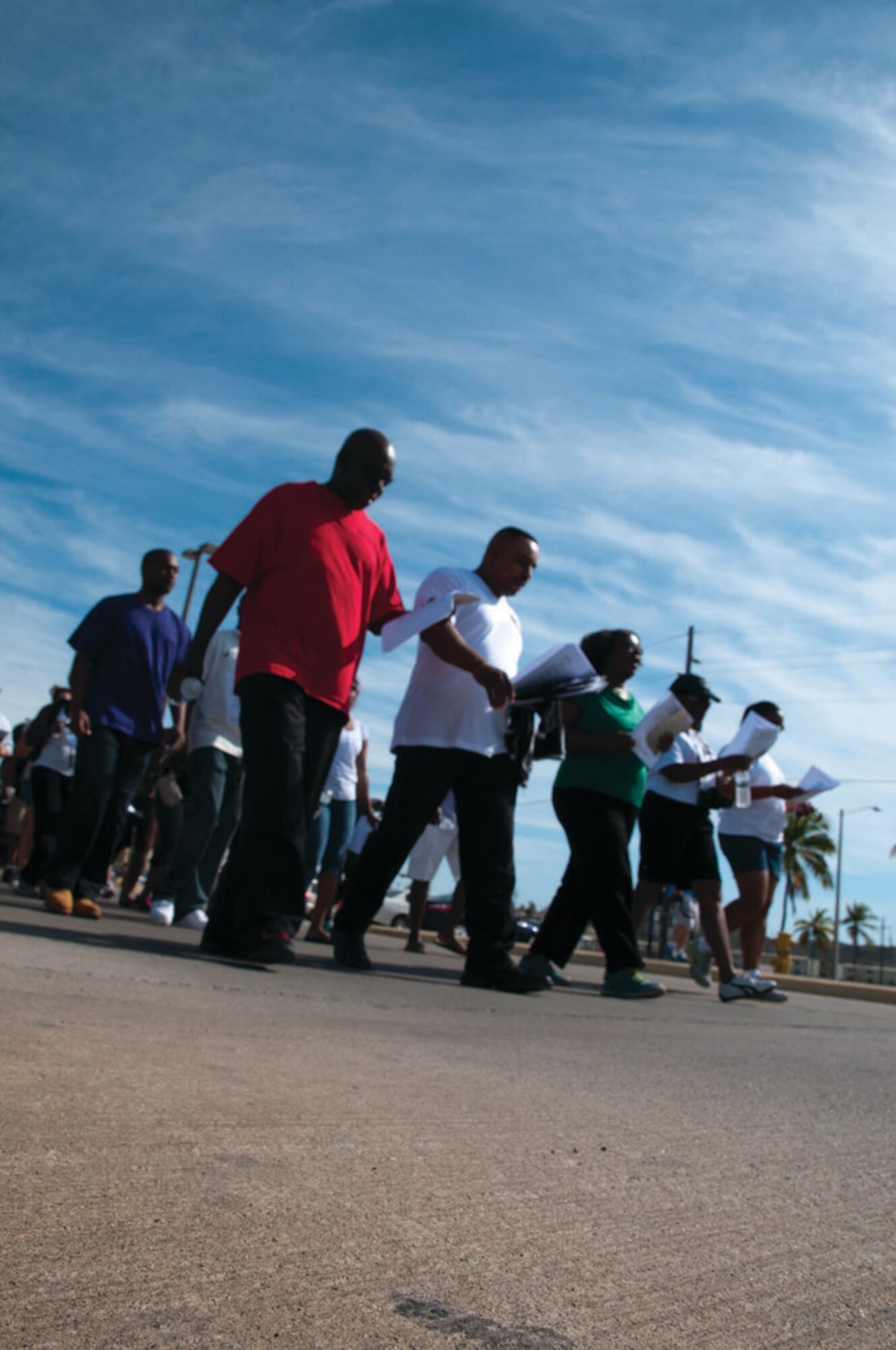 Base residents of Guantanamo Bay, Cuba participate in the Black Heritage Organization's Martin Luther King, Jr. memorial march at the Naval Exchange atrium Jan. 20, 2014 at Guantanamo Bay, Cuba. The march was meant as a way for the GTMO community to reflect on the work and contributions King made for the African American community. (Army National Guard photo by Sgt. David Bolton, 133rd Mobile Public Affairs Detachment/JTF-GTMO Public Affairs)
