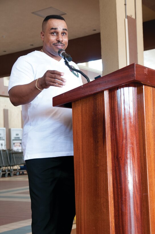 Joint Task Force Guantanamo's Equal Opportunity Manager, Master Sgt. Murray Taylor, speaks to a gathered crowd about the life and work of Dr. Martin Luther King, Jr. at the Naval Exchange atrium Jan. 20, 2014 at Guantanamo Bay, Cuba. The crowd conducted a memorial march that took them from the NEX to the Naval Base Chapel. (Army National Guard photo by Sgt. David Bolton, 133rd Mobile Public Affairs Detachment/JTF-GTMO Public Affairs)