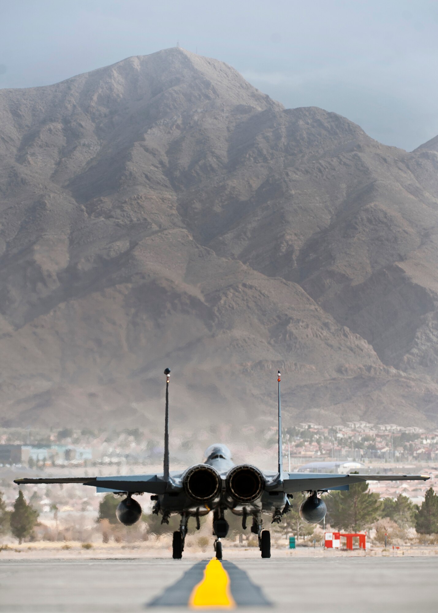 A U.S. Air Force F-15E Strike Eagle from 391st Fighter Squadron from Mountain Home Air Force Base, Idaho, taxis to the runway before a training mission during Red Flag 14-1 Jan. 30, 2014, at Nellis AFB, Nev. More than 3,200 service members are currently participating in the combat exercise Red Flag 14-1 which is hosted by the 414th Combat Training Squadron. (U.S. Air Force photo/Senior Airman Brett Clashman)
