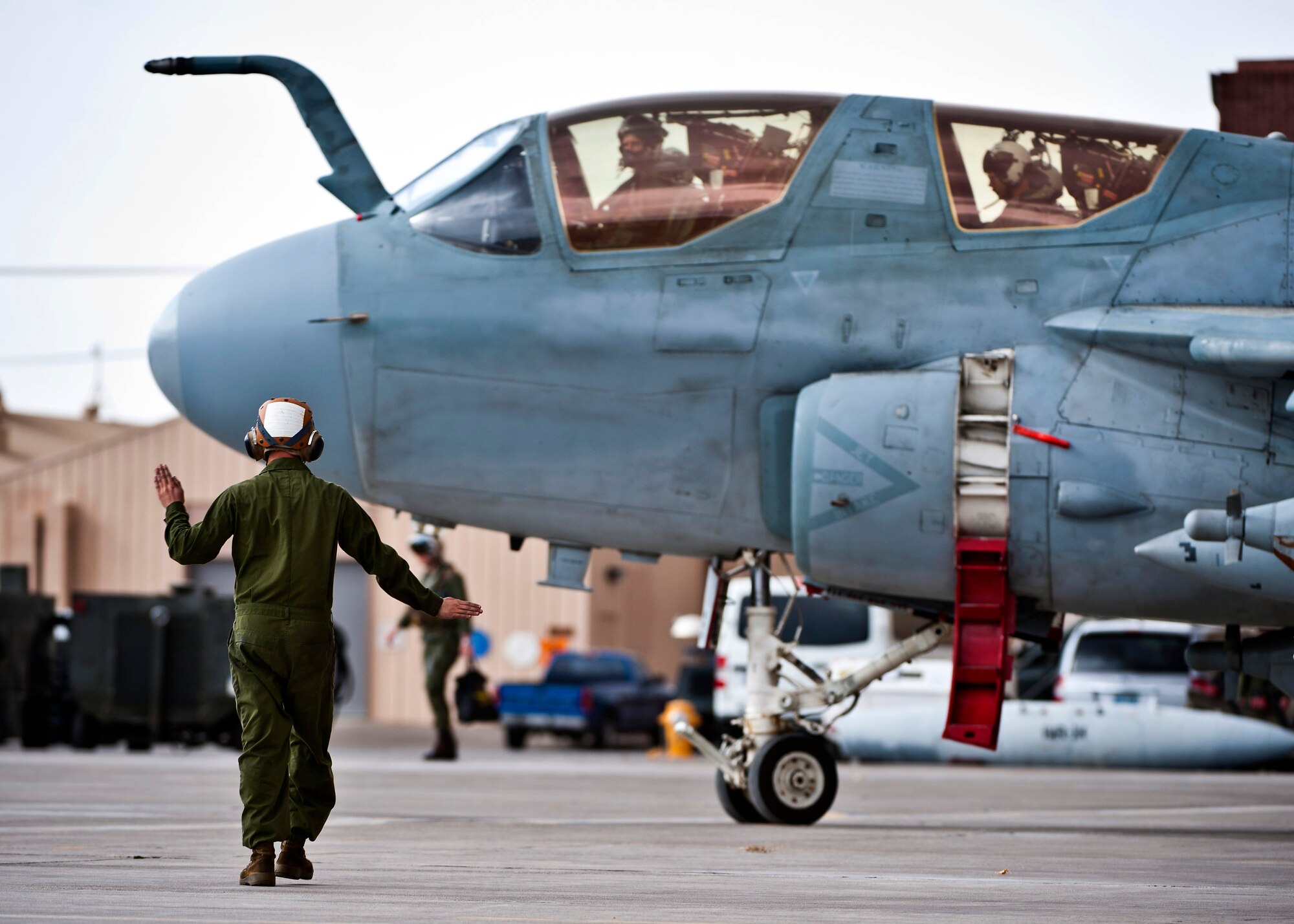 U.S. Marine Corps Gunnery Sgt. Kyle Smith, 2nd Marine Aircraft Wing, Marine Tactical Electronic Warfare Squadron 4 crew chief, marshals an EA-6B Prowler during Red Flag 14-1 Jan. 30, 2014, at Nellis Air Force Base, Nev. The Prowler is a fully integrated electronic warfare system combining long-range, all-weather capabilities with advanced electronic countermeasures.More than 440,000 service members have participated in Red Flag since it began in 1975, including more than 145,000 aircrew members flying more than 385,000 sorties and logging more than 660,000 flight hours. (U.S. Air Force photo/Senior Airman Brett Clashman)