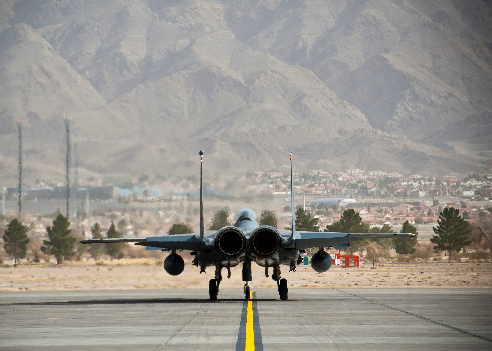 A U.S. Air Force F-15E assigned to the 391st Fighter Squadron, Mountain Home Air Force Base, Idaho, taxis to the runway during Red-Flag 14-1 Jan. 30, 2014, at Nellis AFB, Nev. Red Flag is an opportunity for U.S. and allied forces to work and train together during realistic combat scenarios. Training together is essential because all four branches of the U.S. military and foreign allies may work together during future real-world conflicts or wars. (U.S. Air Force photo by Airman 1st Class Thomas Spangler) 