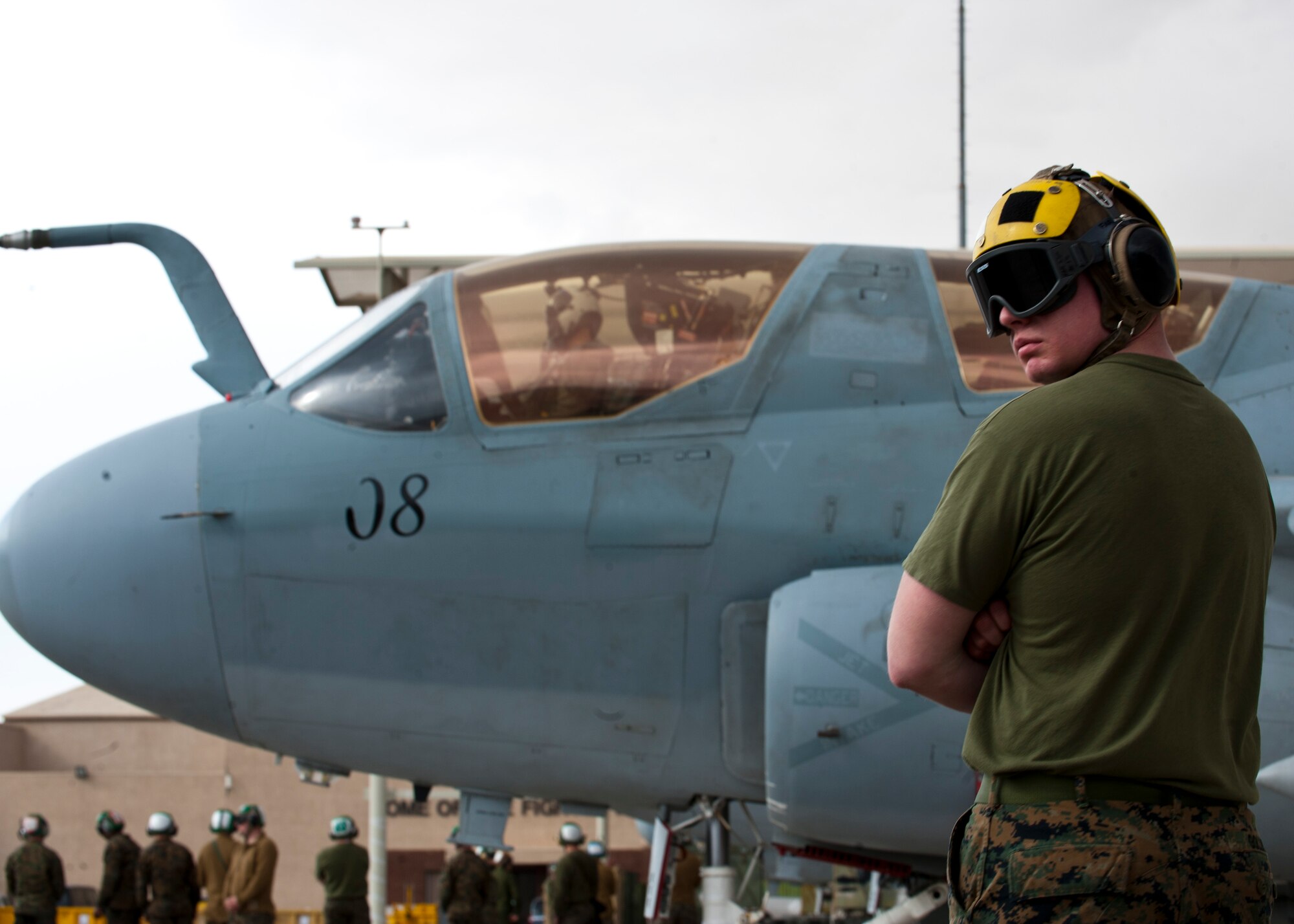 U.S. Marine Corps Point Checker Cpl. Josh Gollnick, 2nd Marine Aircraft Wing, Marine Tactical Electronic Warfare Squadron 4, prepares for the departure of an EA-6B Prowler assigned to 2nd Marine Aircraft Wing, Marine Corps Air Station Cherry Point, N.C., during Red Flag 14-1 Jan. 30, 2014, at Nellis Air Force Base, Nev. Red Flag provides realistic combat training in a contested, degraded and operationally limited environment. These stressors provide aircrews with real-time war scenarios and helps ground crews test and improve their operational readiness. (U.S. Air Force photo by Airman 1st Class Thomas Spangler)