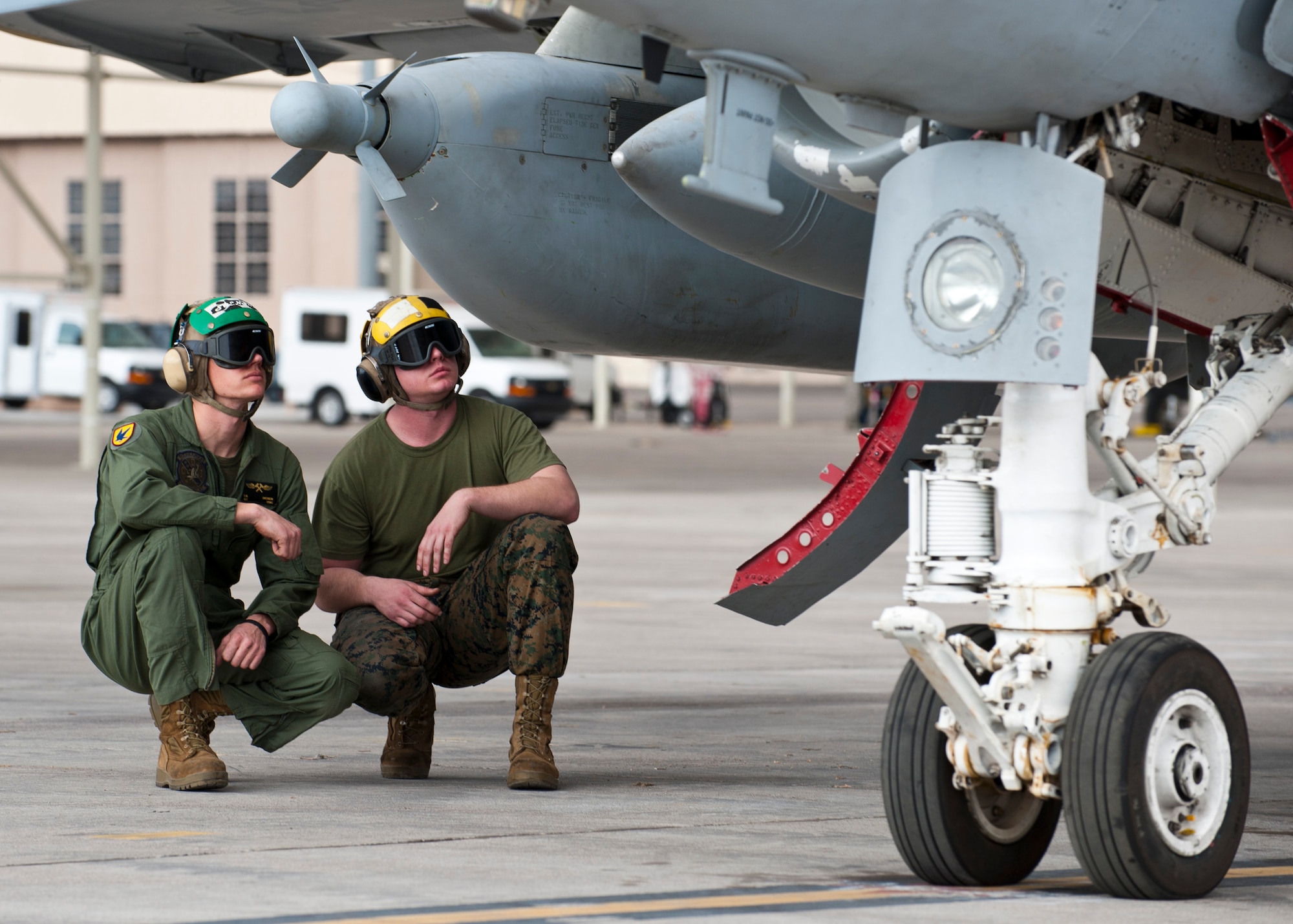 U.S. Marine Corps Point Checker Sgt. Eric Swenson (left), 2nd Marine Aircraft Wing, Marine Tactical Electronic Warfare Squadron 4, and 2 MAW/VMAQ-4 Point Checker Cpl. Josh Gollnick, inspect an EA-6B Prowler assigned to 2nd MAW from Marine Corps Air Station Cherry Point, N.C., prior to launch during Red Flag 14-1 Jan. 30, 2014, at Nellis Air Force Base, Nev. U.S. Air Force units as well as U.S. Army, U.S. Navy, and U.S. Marine Corps units participate in Red Flag. Red Flag was established in 1975 to simulate the first 10 combat missions’ pilots would face to increase their survivability. (U.S. Air Force photo by Airman 1st Class Thomas Spangler)