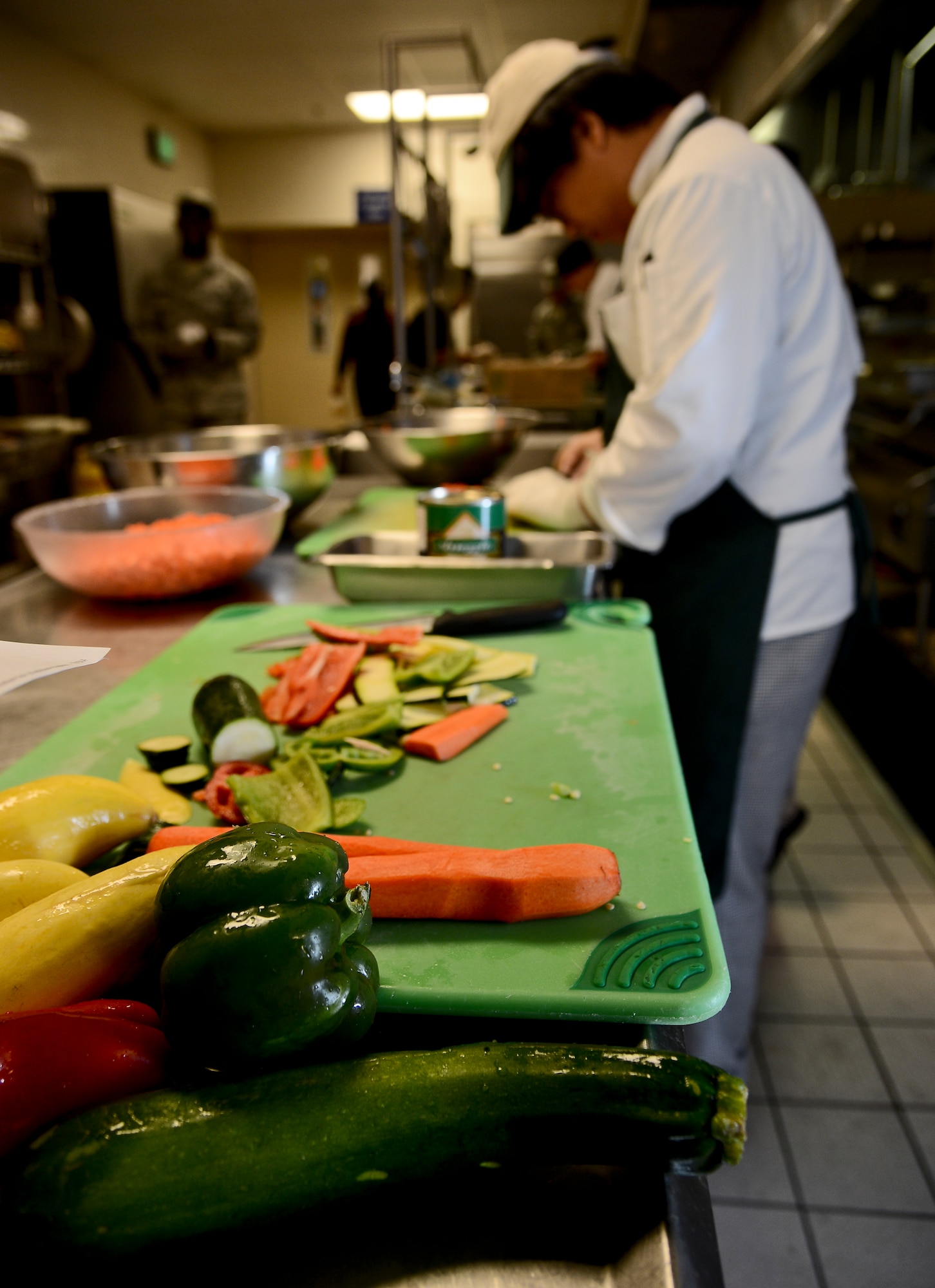 Students from Chamberlain High School visit Diners Reef to learn from food service Airmen and apply skills learned in the class room to a real life senario at MacDill Air Base Fla. Students paired up with Airmen assigned to different zones within the kichen including salads, deli, Mediterranean, main –line cooking, light grilling and express. (U.S. Air Force photo by Senior Airman Melanie Bulow-Gonterman/Released)  