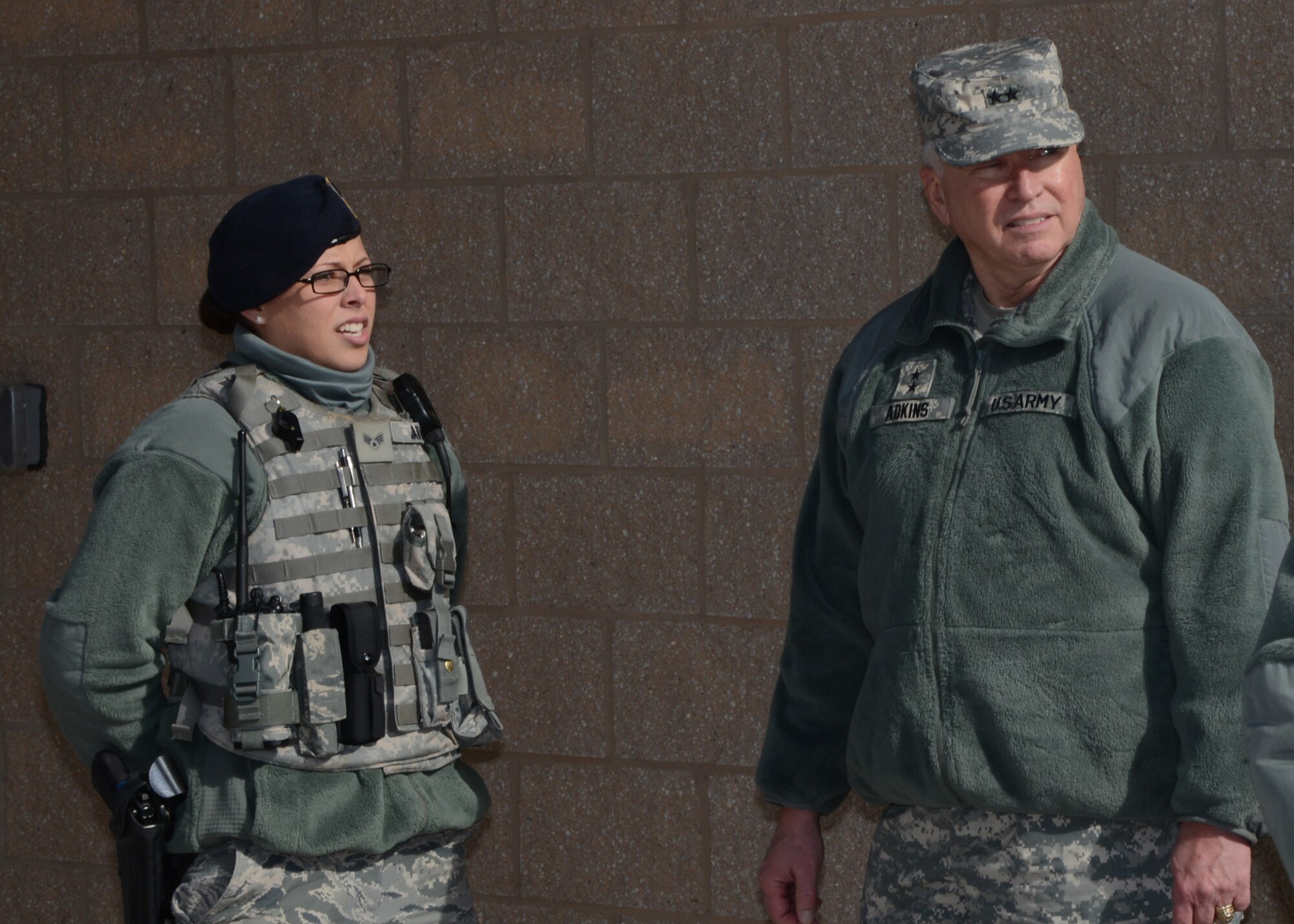 U.S. Army Maj. Gen. James Adkins, the Adjutant General for the Maryland National Guard, speaks with Senior Airman Miriam Jarvis, 175th Security Forces Squadron, during his inspection of the 175th Wing facilities.  The inspection took place January 31, 2014 at Warfield Air National Guard base, Baltimore, Md. (Air National Guard photo by Tech. Sgt. Chris Schepers/RELEASED)