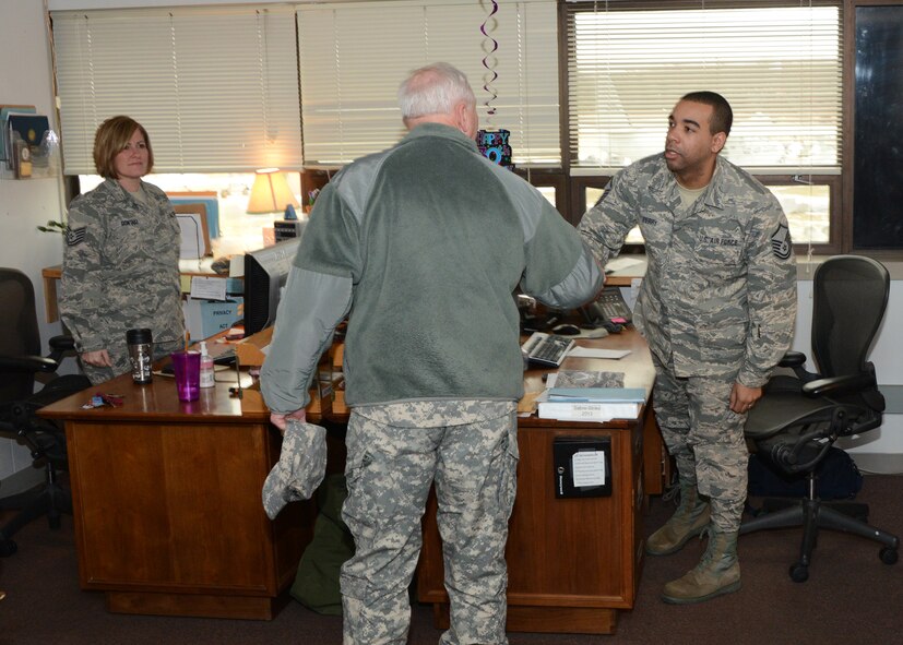 U.S. Army Maj. Gen. James Adkins, the Adjutant General for the Maryland National Guard, stops and greets Master Sgt. Dallas Perry and Tech. Sgt. Kimberly Gontasz, 175th Maintenance Operations Flight, during an inspection of the 175th Wing facilities.  Gen. Adkins performed the wing inspection January 31, 2014 at Warfield Air National Guard base, Baltimore, Md. (Air National Guard photo by Tech. Sgt. Chris Schepers/RELEASED)