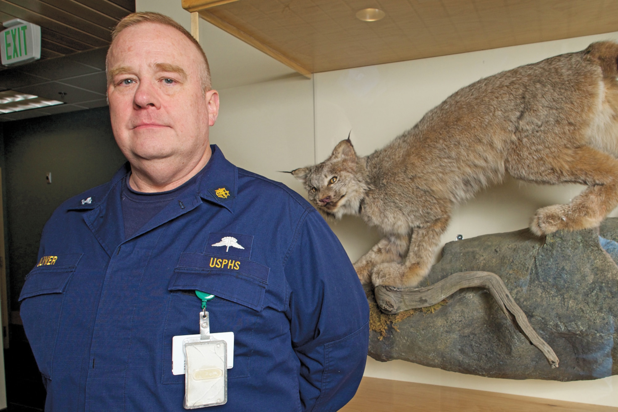 JOINT BASE ELMENDORF-RICHARDSON, Alaska -- Public Health Service Capt. Kelton Oliver, JBER hospital Traumatic Brain Injury Clinic medical director, represents the PHS Commissioned Corps in the Lynx Wing of the hospital. Along with the National Oceanic and Atmospheric Administration and the military services, PHS is one of six uniformed services. (U.S. Air Force photo/David Bedard)