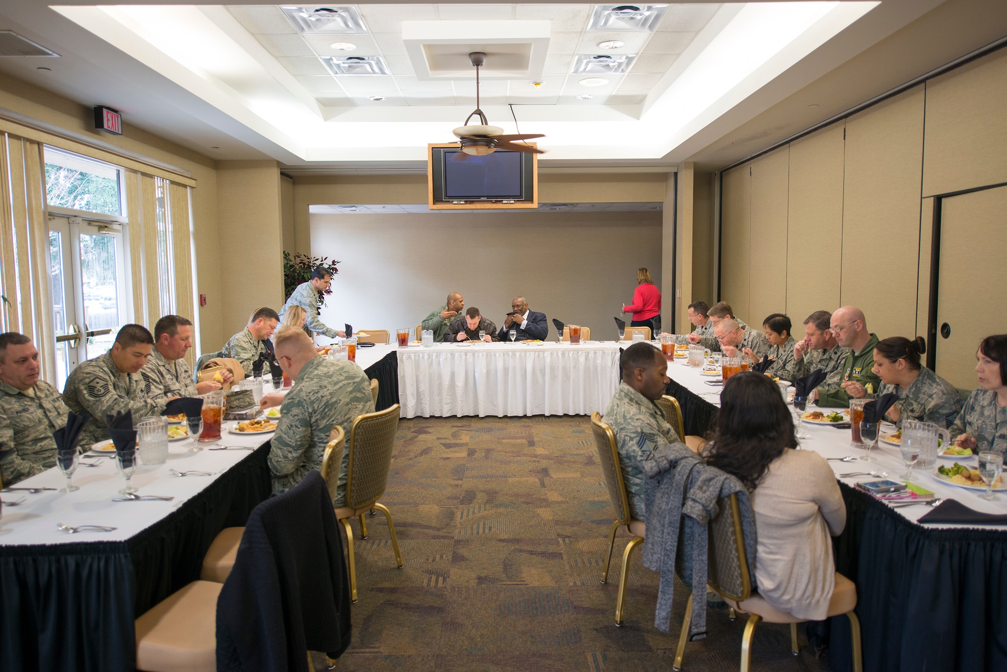 Attendees at the 23d Force Support Squadron’s Lunch and Learn seminar eat and chat before listening to  the Honorable James F. Council Jr., Judge of the Juvenile Court of Lowndes County, at Moody Air Force Base, Ga., Jan. 30, 2014. Council spoke about his experience in the Juvenile Court and future changes to policy impacting Moody’s Airmen. (U.S. Air Force photo by Airman 1st Class Ryan Callaghan/Released)
