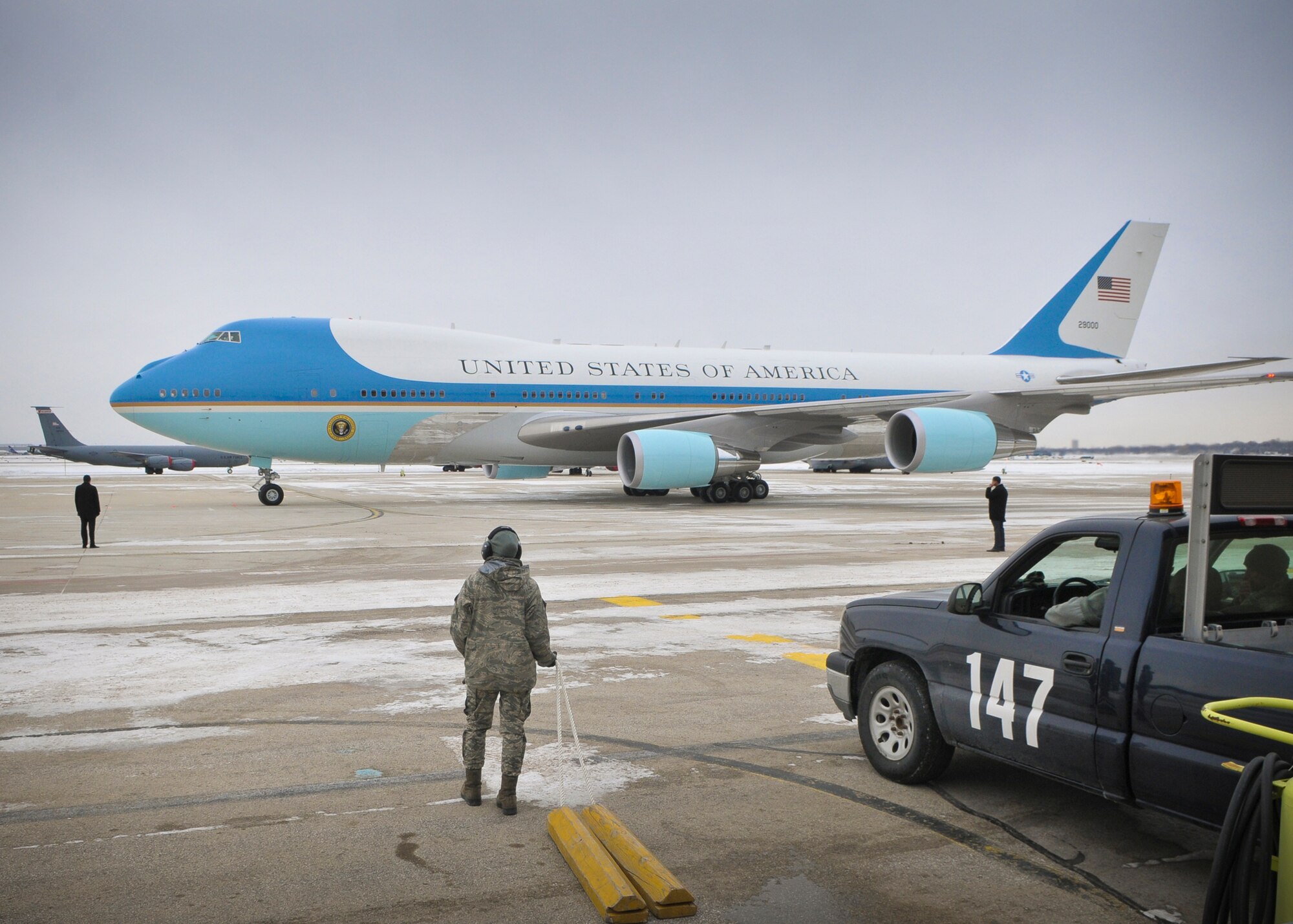 Airman First Class Emily Albright (center) prepares to set chocks around Air Force One’s landing gear Thursday, Jan. 30, 2014.
Members of the 128th Air Refueling Wing, Wisconsin Air National Guard, supported President Obama’s visit to the Milwaukee area. (U.S. Air National Guard photo by 1st Lt. Nathan T. Wallin/Released)