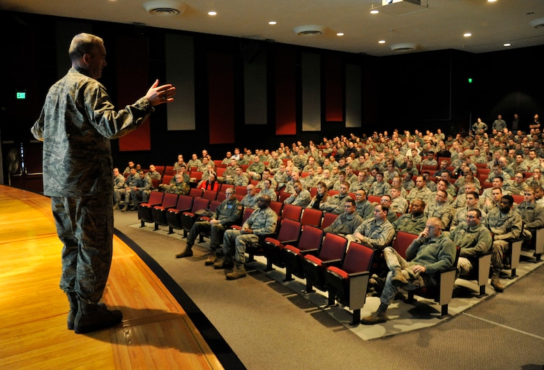 Col. Brian Newberry, 92nd Air Refueling Wing commander, speaks with Team Fairchild during a Commander's Call held in the base theater at Fairchild Air Force Base, Wash., Jan. 30, 2014. Newberry spoke on topics impacting the Air Force and the upcoming inspection Team Fairchild will participate in. (U.S. Air Force photo by Airman 1st Class Ryan Zeski/Released)