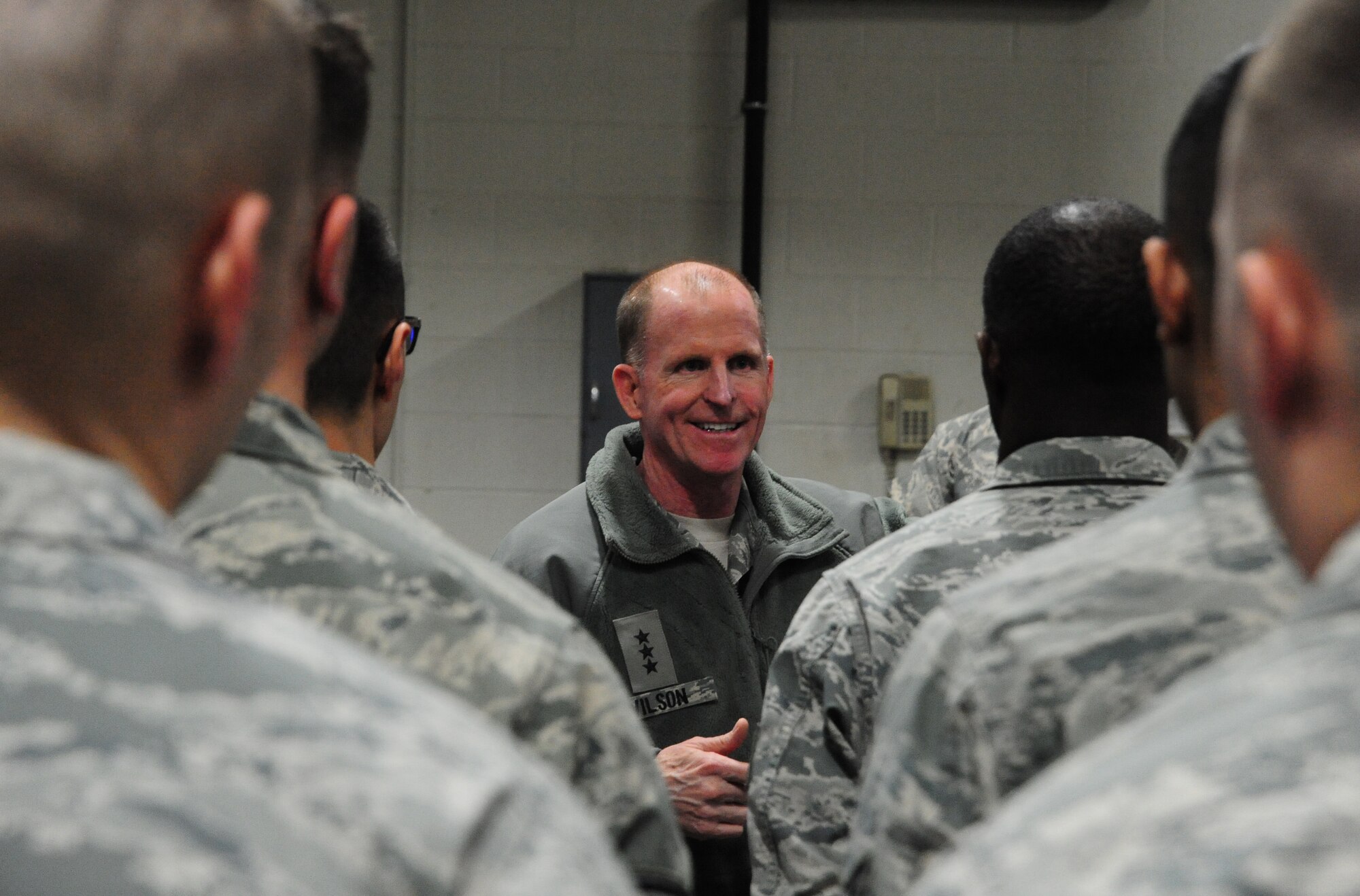 Lt. Gen. Stephen Wilson, commander of Air Force Global Strike Command, speaks to Airmen from the 509th Civil Engineer Squadron snow removal and heavy equipment shop during a visit to Whiteman Air Force Base, Mo., Jan. 24, 2014. Air Force Global Strike leadership visited Team Whiteman to congratulate them on a job well done during a recent Nuclear Surety Inspection. (U.S. Air Force photos by Staff Sgt. Nick Wilson/Released)