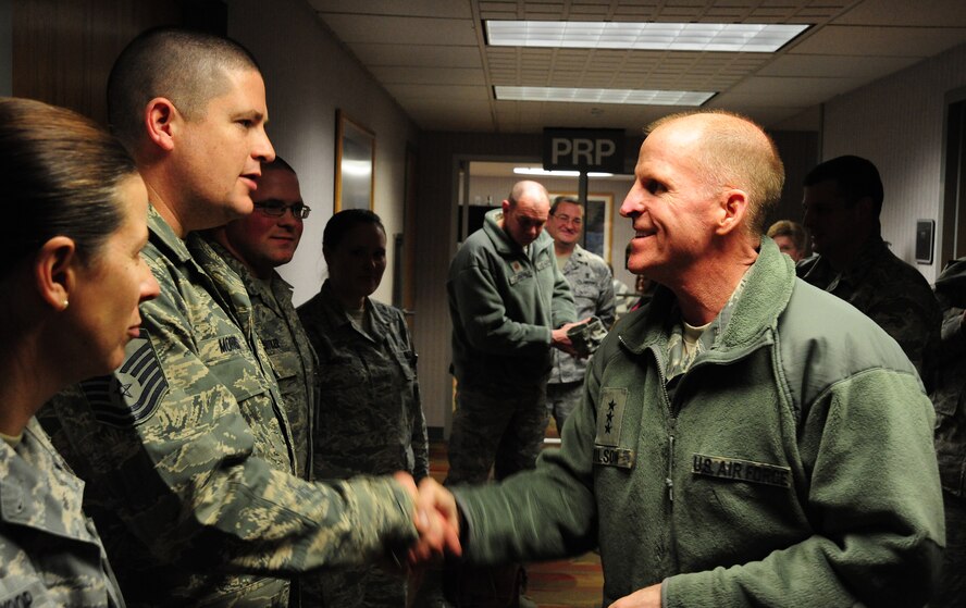 Master Sgt. Matthew Morris, 131st Medical Group medical treatment facility personnel reliability program monitor is coined by Lt. Gen. Stephen Wilson, commander of Air Force Global Strike Command, during a visit to Whiteman Air Force Base, Mo., Jan. 24, 2014. Air Force Global Strike leadership visited Team Whiteman to congratulate them on a job well done during a recent Nuclear Surety Inspection. (U.S. Air Force photos by Staff Sgt. Nick Wilson/Released)