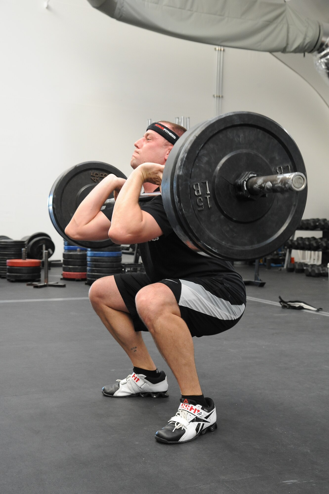 Chief Petty Officer Nicholas Hunt, Naval Operations Support Center avionics technician chief, demonstrates proper form to reduce the risk of injury Jan. 27 in the warrior fitness center. Since 2004, the Air Force has lost approximately 400 personnel due to recreational activities, according to Ben Bruce, 56th Fighter Wing ground safety manager. (U.S. Air Force photo/Airman 1st Class Pedro Mota)