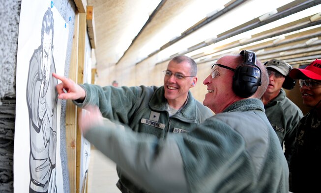 Lt. Gen. Stephen Wilson, commander of Air Force Global Strike Command, shares a laugh with Brig. Gen. Thomas A. Bussiere, 509th Bomb Wing commander, during a combat arms tour at Whiteman Air Force Base, Mo., Jan. 24, 2014. Air Force 
Global Strike leadership visited Team Whiteman to congratulate them on a job well done during a recent Nuclear Surety Inspection. (U.S. Air Force photos by Staff Sgt. Nick Wilson/Released)