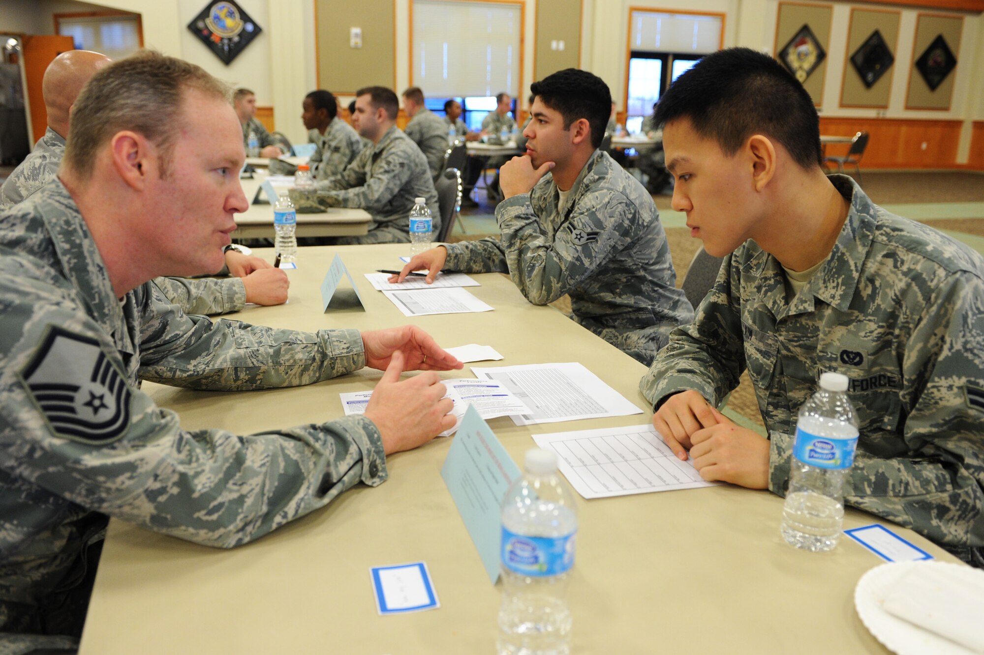 Master Sgt. Michael Rinck, 341st Maintenance Operations Squadron ICBM plans and scheduling NCO in charge (left), discusses the enlisted evaluation process with Airman 1st Class Brian Kim, 819th RED HORSE Squadron member, during Speed Mentoring at the Grizzly Bend on Jan. 23. The purpose of the event was to allow Airmen a chance to gain knowledge on promotions, feedback, the enlisted force structure and other topics. (U.S. Air Force photo/Senior Airman Katrina Heikkinen)