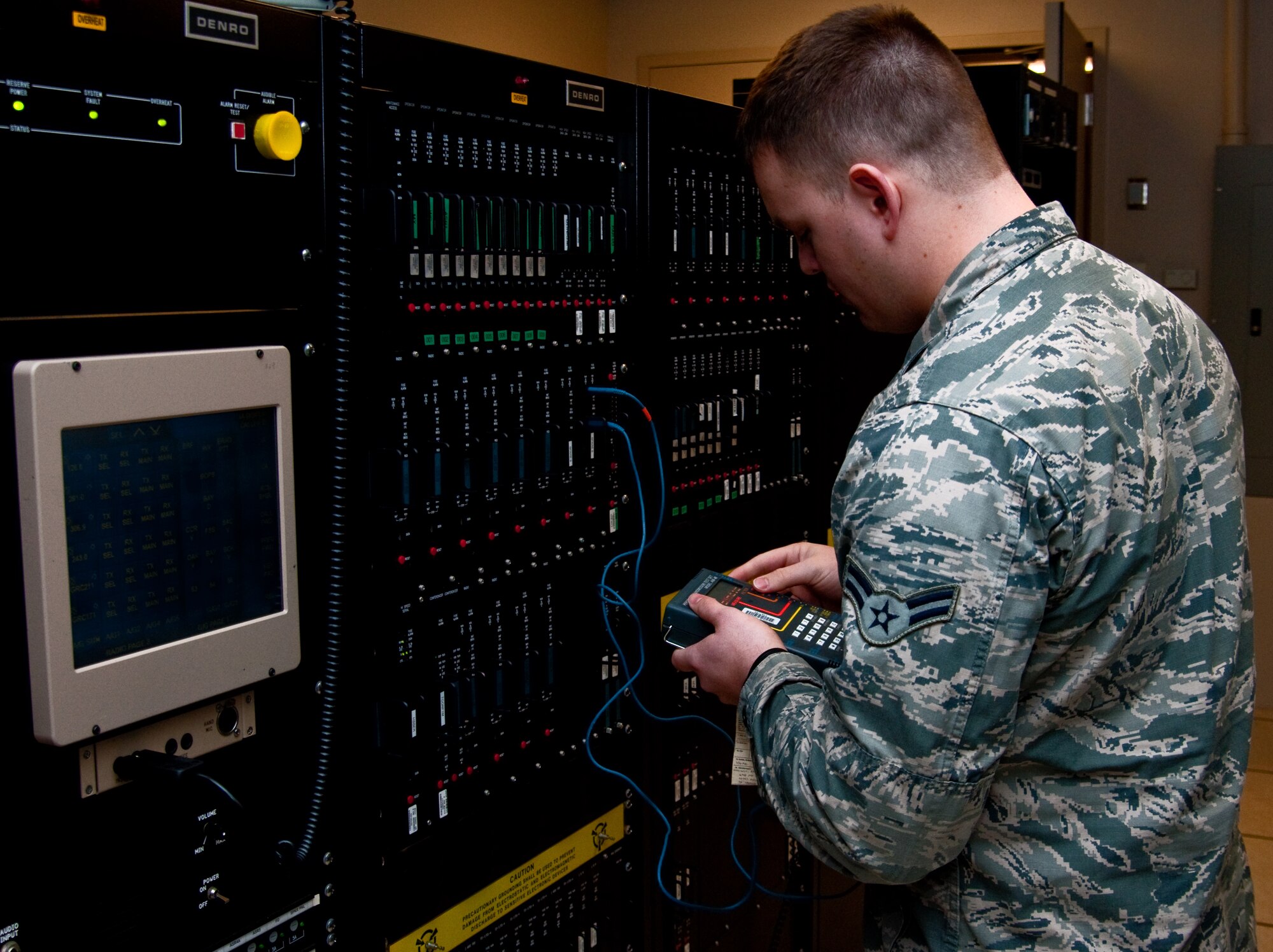 Airman 1st Class David Holliman, 60th Communications Squadron, services airfield radio equipment Jan. 23, 2014, at Travis Air Force Base, Calif. Holliman was recently named the Air Force’s Outstanding Airfield Systems Airman of the Year for 2013. (U.S. Air Force photo by Senior Airman Charles V. Rivezzo