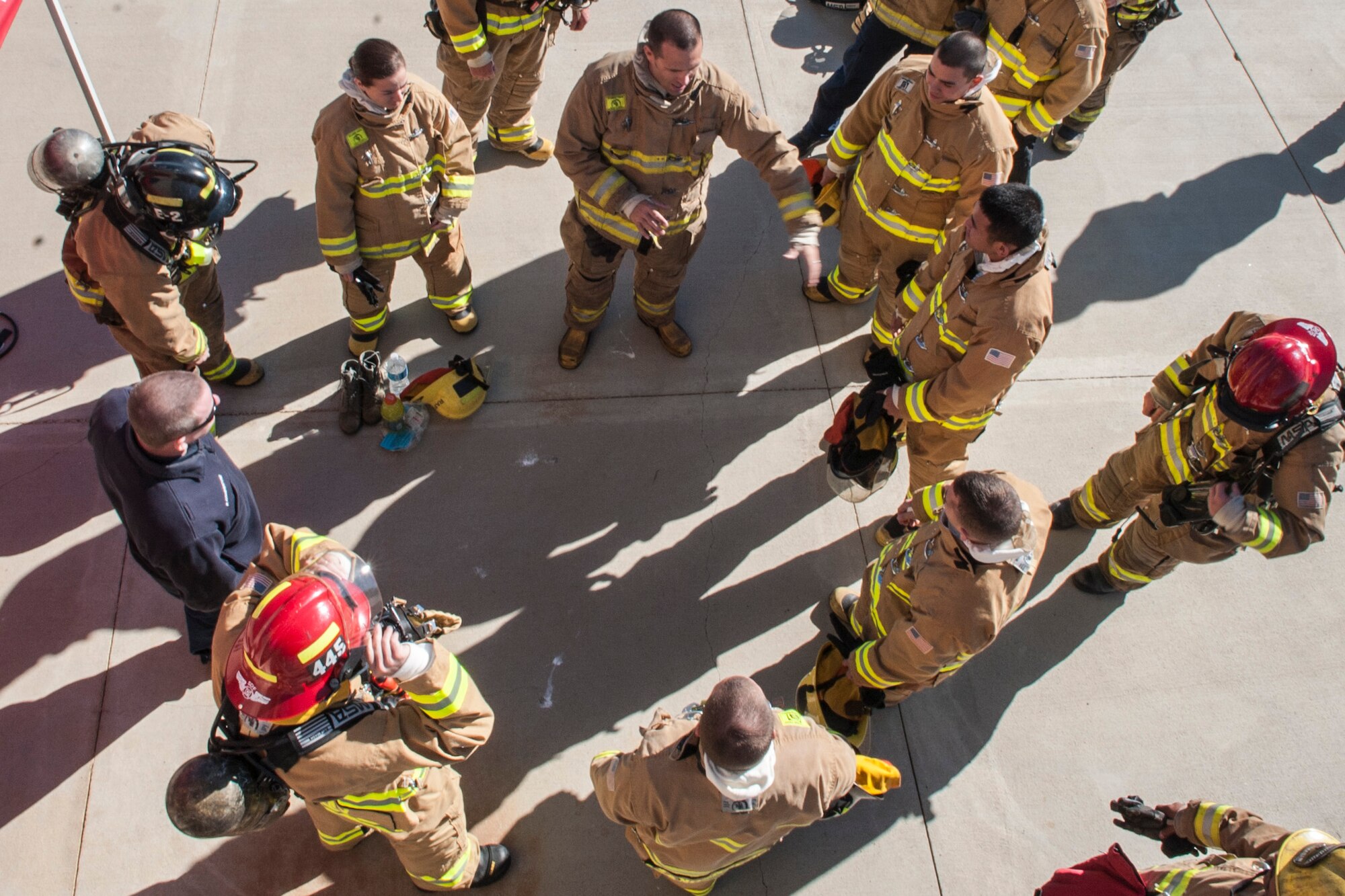 VANDENBERG AIR FORCE BASE, Calif. – Vandenberg Airmen of the quarter are briefed before entering a simulated burning building here Jan. 29. Col. Keith Balts, 30th Space Wing commander, along with Airmen of the quarter winners, got the opportunity to work with the Vandenberg Firefighters during a burning building exercise. (U.S. Air Force photo/Airman 1st Class Yvonne Morales)