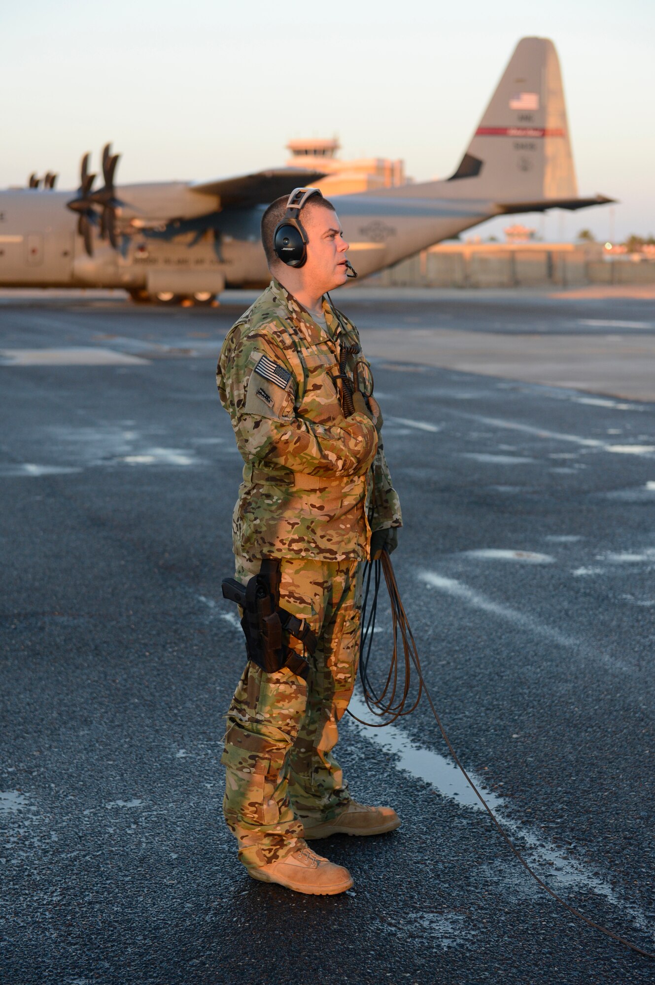 Master Sgt. Chad Gurnon, a loadmaster with the 737th Expeditonary Airlift Squadron, readies his C-130J Hercules aircraft prior to its launch.  Gurnon is deployed from the 143rd Airlift Squadron, Rhode Island Air National Guard. This is his 15th deployment to the Central Command area of operations.  (U.S. Air Force photo by Master Sgt. Christopher Campbell)
