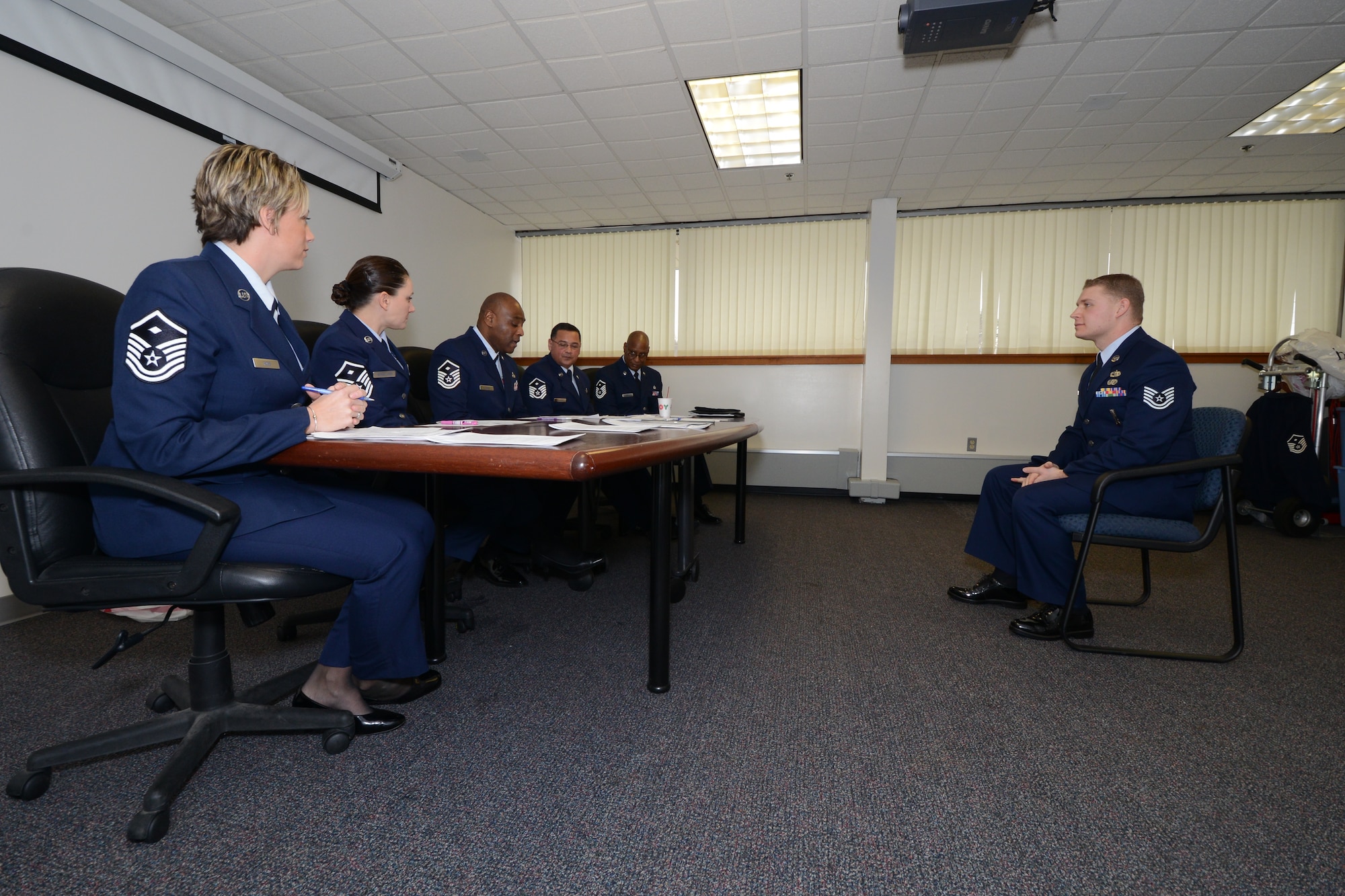 Tech Sgt. Brian Gilbert of the 103rd Maintenance Group answers questions from a board of First Sergeants during the annual Diamond Award selection process on January 1, 2014, at Bradley Air National Guard Base, East Granby, CT.  Once a year, the Connecticut Air National Guard’s first sergeants present the Diamond Award to an individual who has shown a great deal of potential for future leadership, had a positive impact on his or her unit, and represents what the Air Force’s core values.  (U.S. Air National Guard photo by Senior Airman Emmanuel Santiago) 