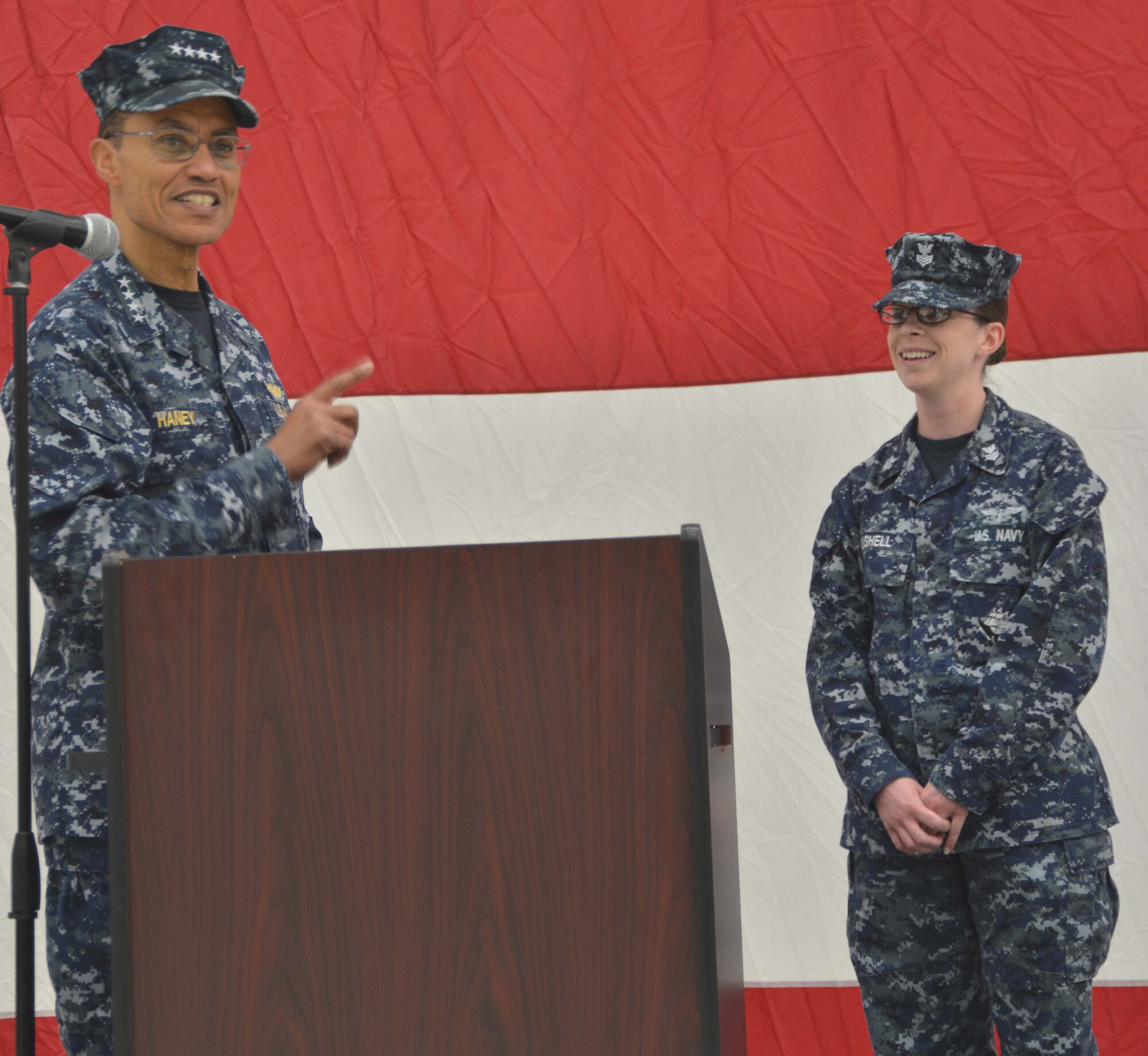 Adm. Cecil Haney, commander of U.S. Strategic Command, answers questions posed by Information Systems Technician 1st Class Erica Bushell during an “all hands” call held Jan. 24 at Tinker AFB. During his visit to Strategic Communications Wing 1, the admiral thanked the Sailors throughout TACAMO for their service and stressed the importance of their contributions to the nation’s nuclear deterrence mission. (Navy photo by Chief Mass Communication Specialist Chris Delano)