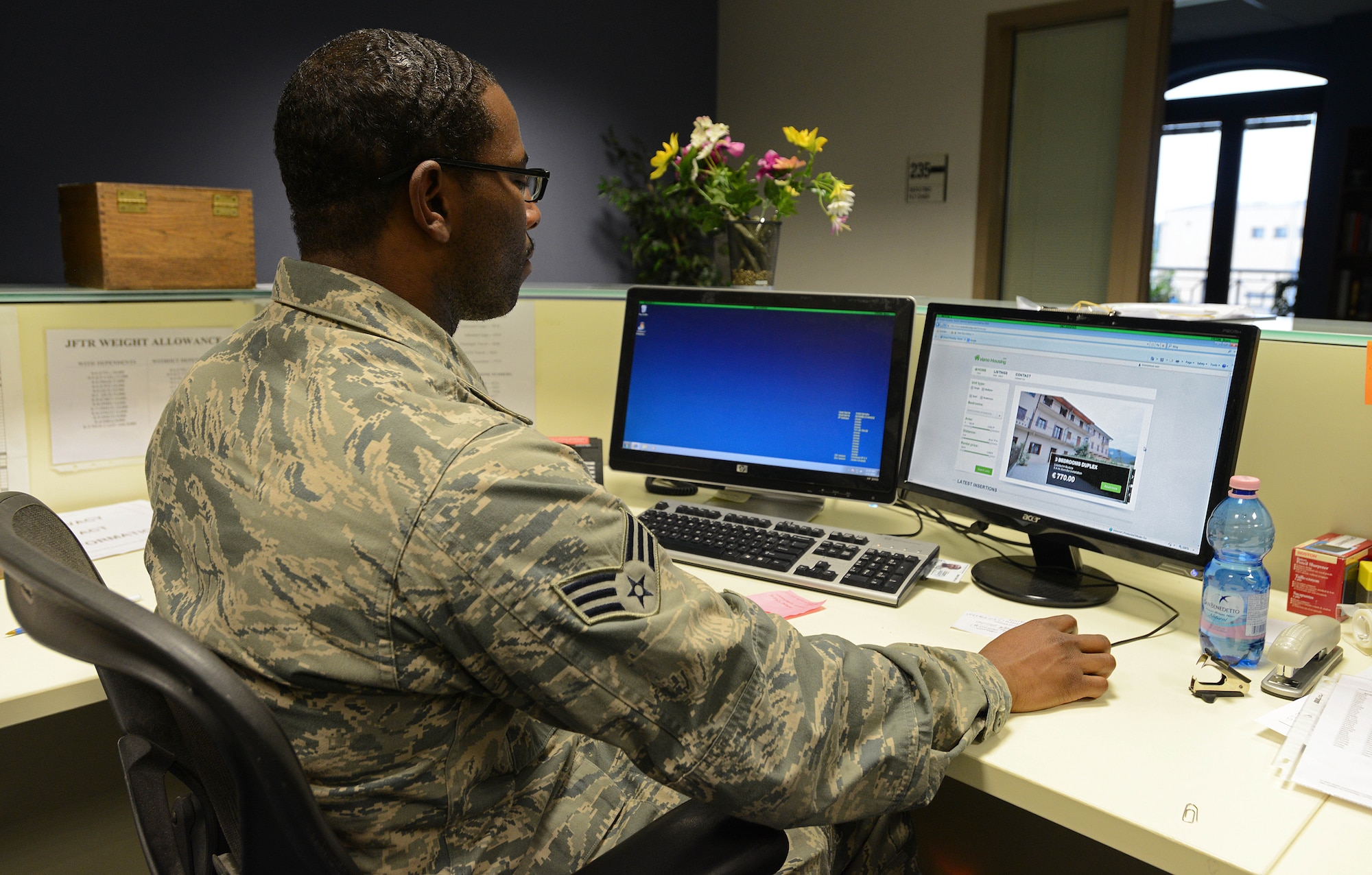 Senior Airman Derrick Bradford, 31st Logistics Readiness Squadron traffic management officer, reviews a house on the temporary housing website created by the Aviano Housing Office, Jan. 30, 2014, at Aviano Air Base, Italy.  Until the Air Force housing website launches in the spring, house hunters will use the temporary site that has the option to narrow searches by number of bedrooms, squared feet and distance from base. (U.S. Air Force photo/Airman 1st Class Deana Heitzman) 